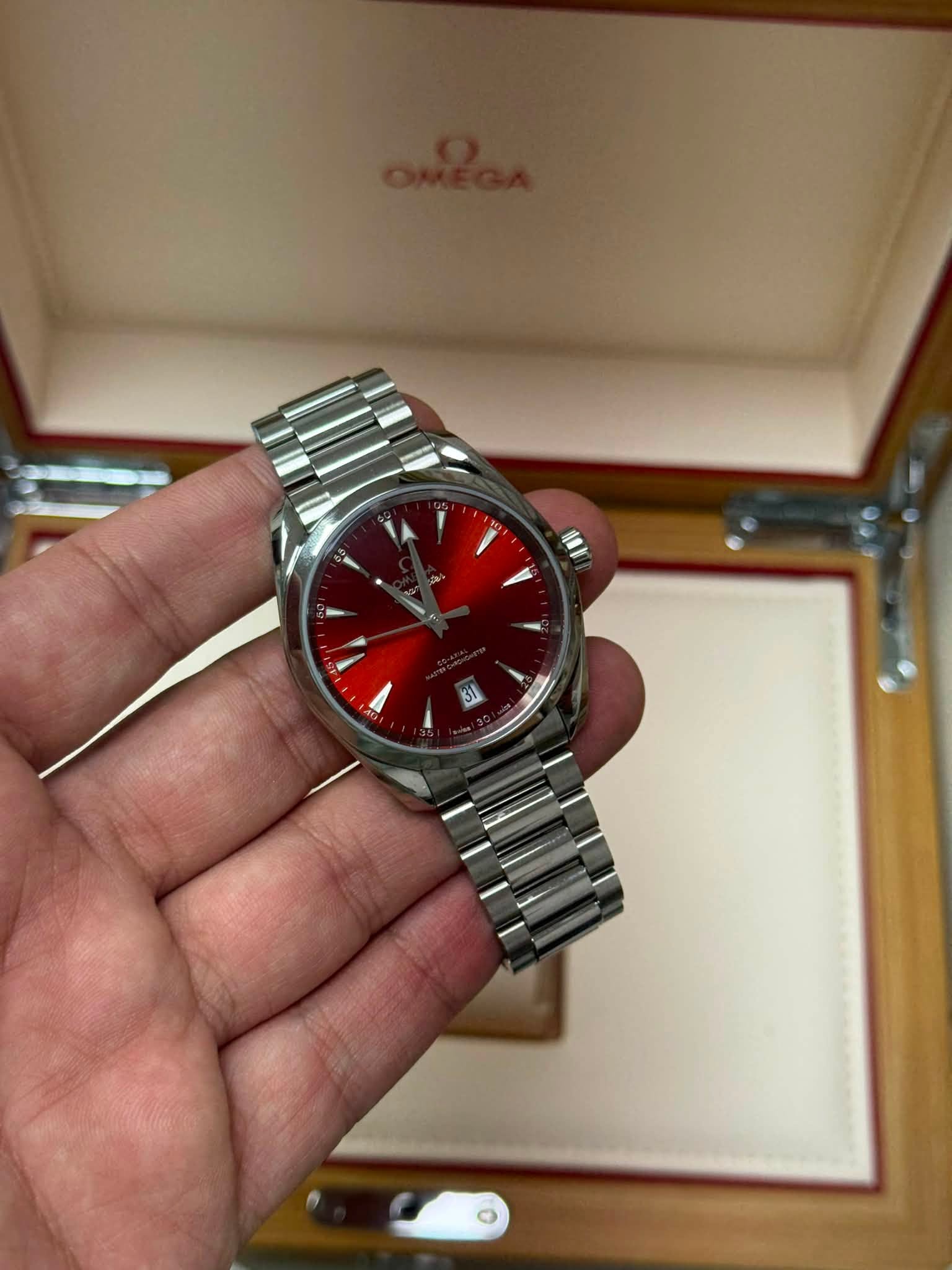 May be an image of wrist watch and text