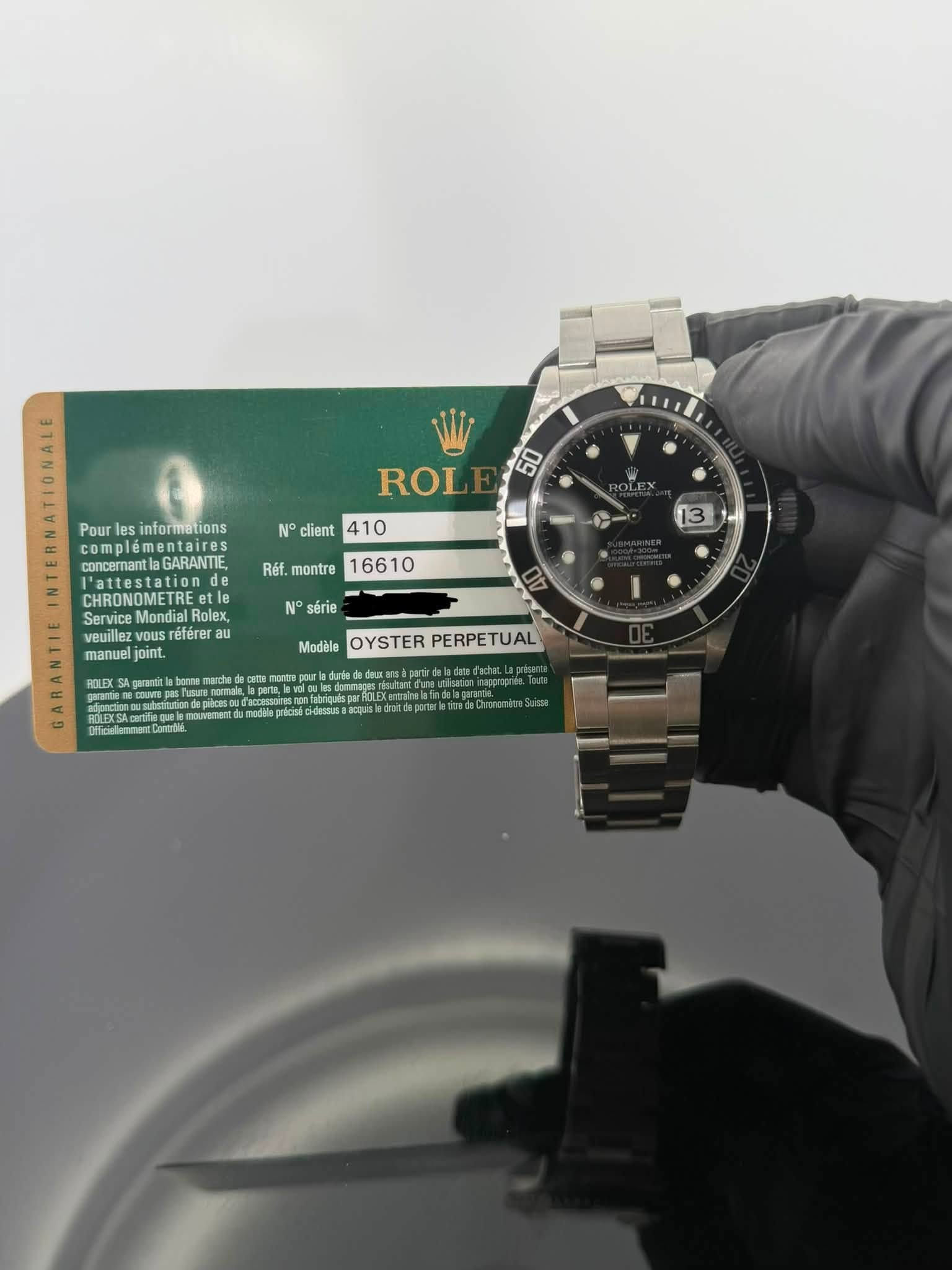 May be an image of wrist watch and text that says 'Pour es informations 00 ROL No client 410 Réf. montre D concernanta GARANTIE tion de CHRONOMETRE Mondial Rolex, veuillez referer…