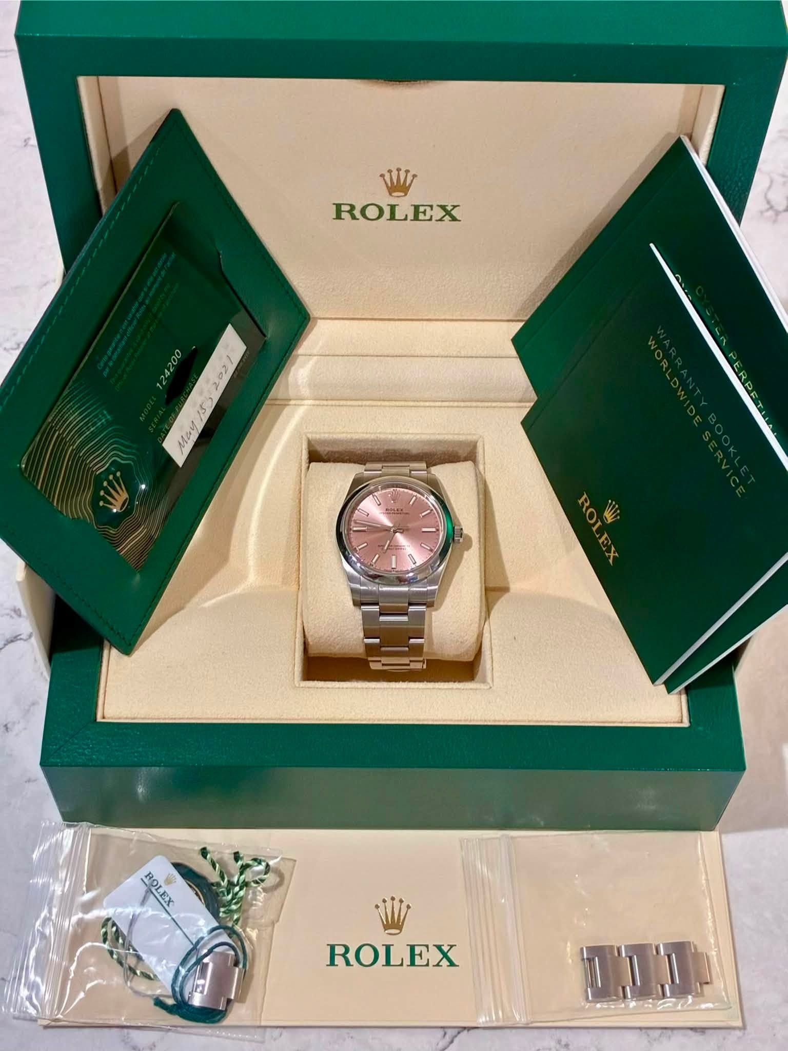 May be an image of wrist watch and text that says 'W ROLEX ၁2 15s SO May 0 F LS ROLEX ROLEX'