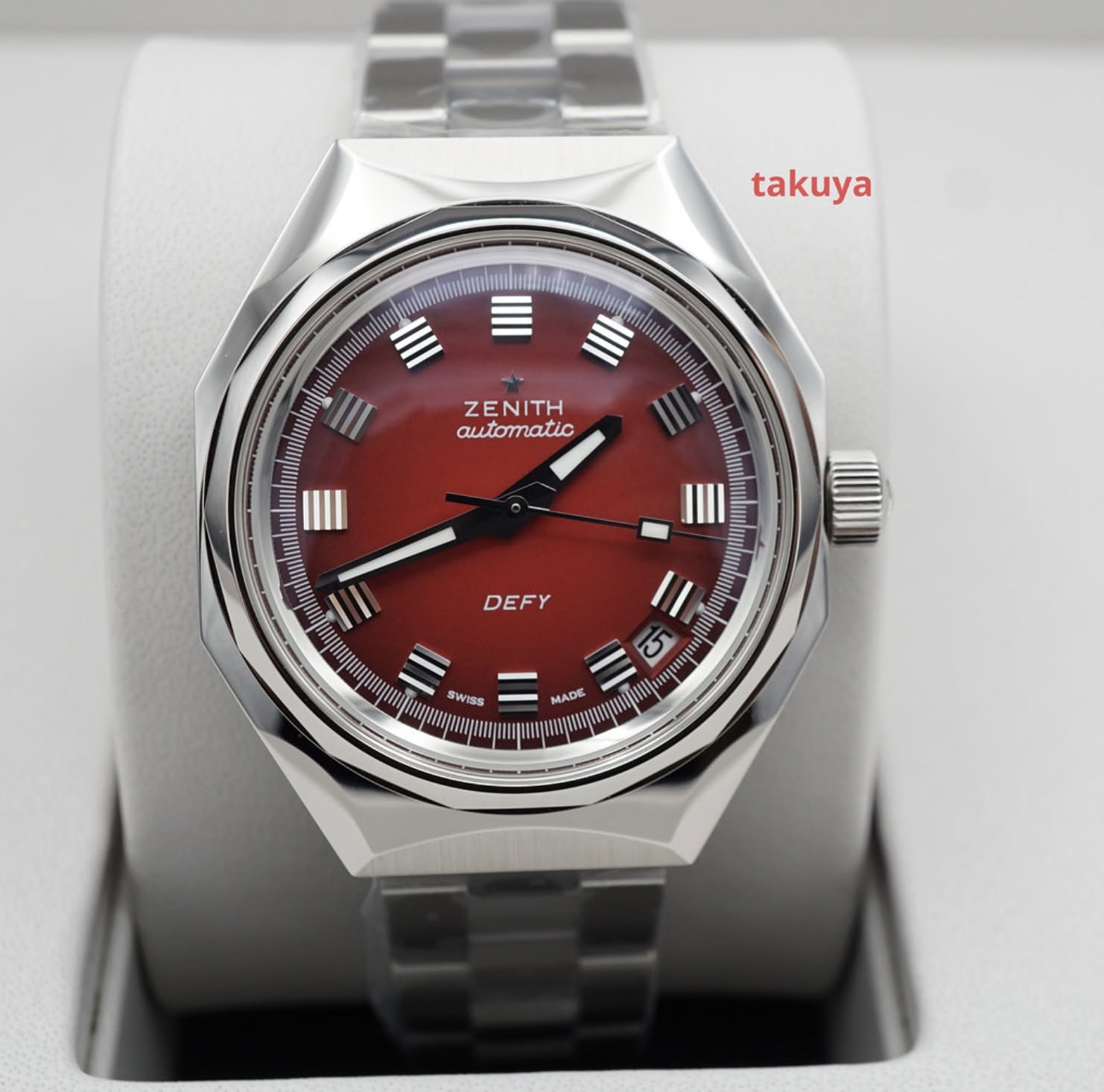 May be an image of wrist watch and text