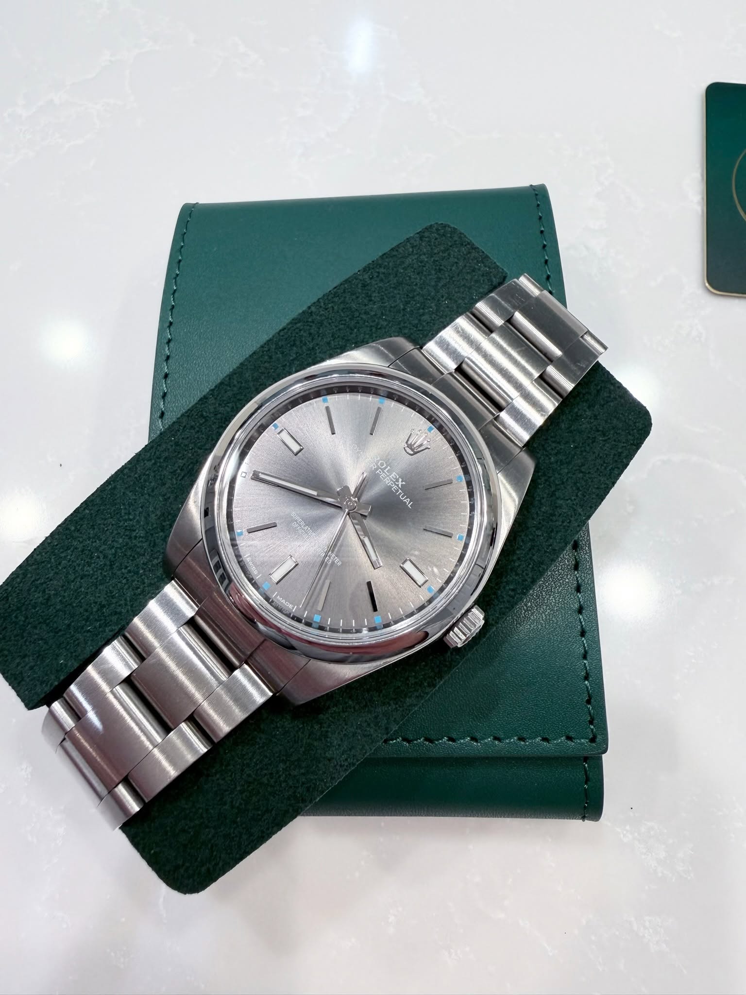 May be an image of wrist watch and text