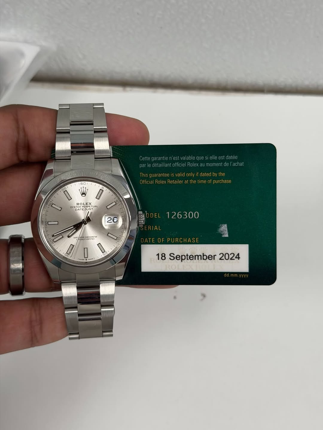 May be an image of wrist watch and text