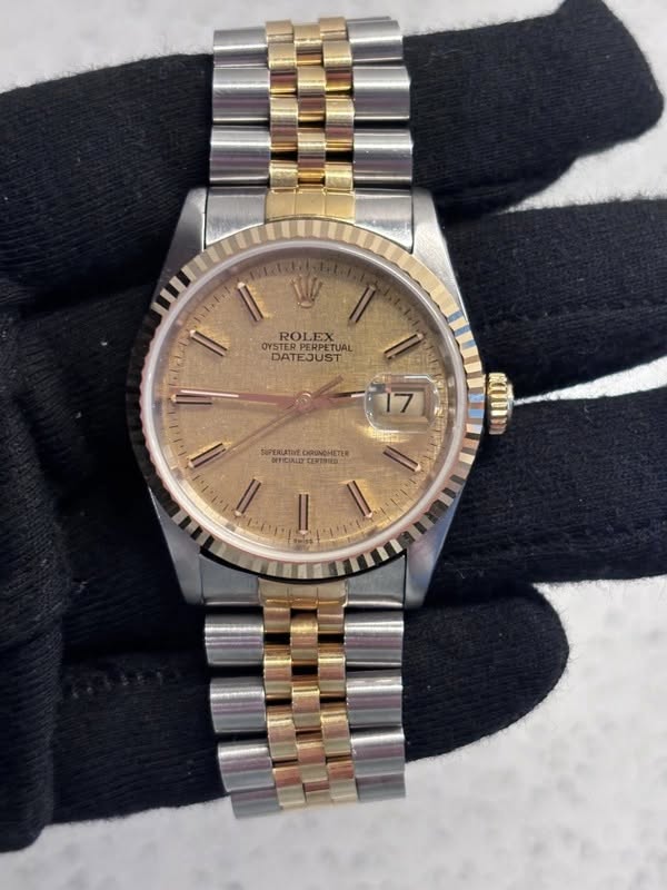 May be an image of wrist watch and text