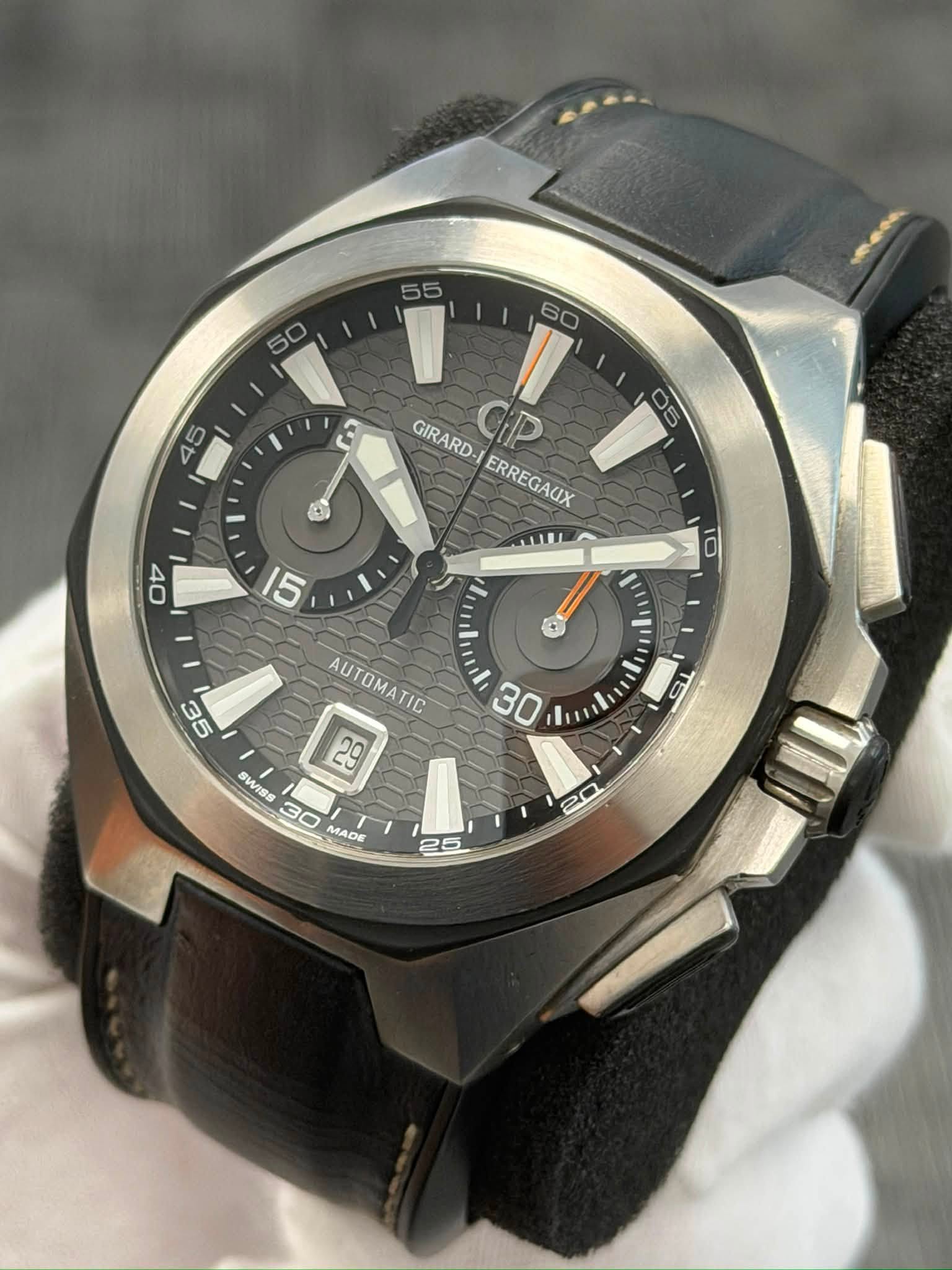 May be an image of wrist watch and text that says ' GIRARD- ERREGAUX ERREGAUX G AUTOMATIC 29 D 30 Bu SWISS 30 MADE n 25'
