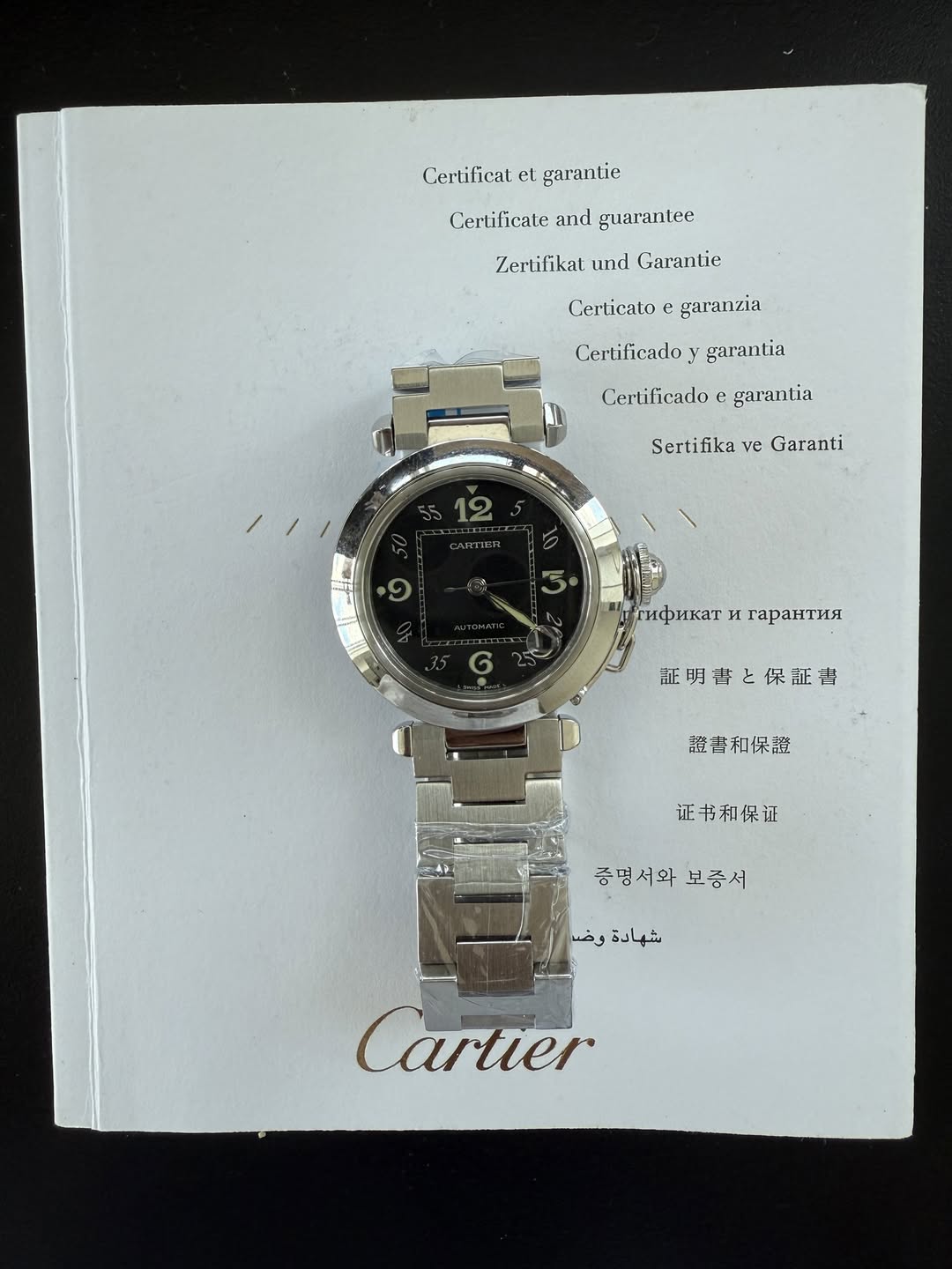 May be an image of digital watch and text that says 'Certilicat el. garantie Certificate Cerificateandgnarantec and guaranlec Zertifikat und Garantic Gerticato garanzia…