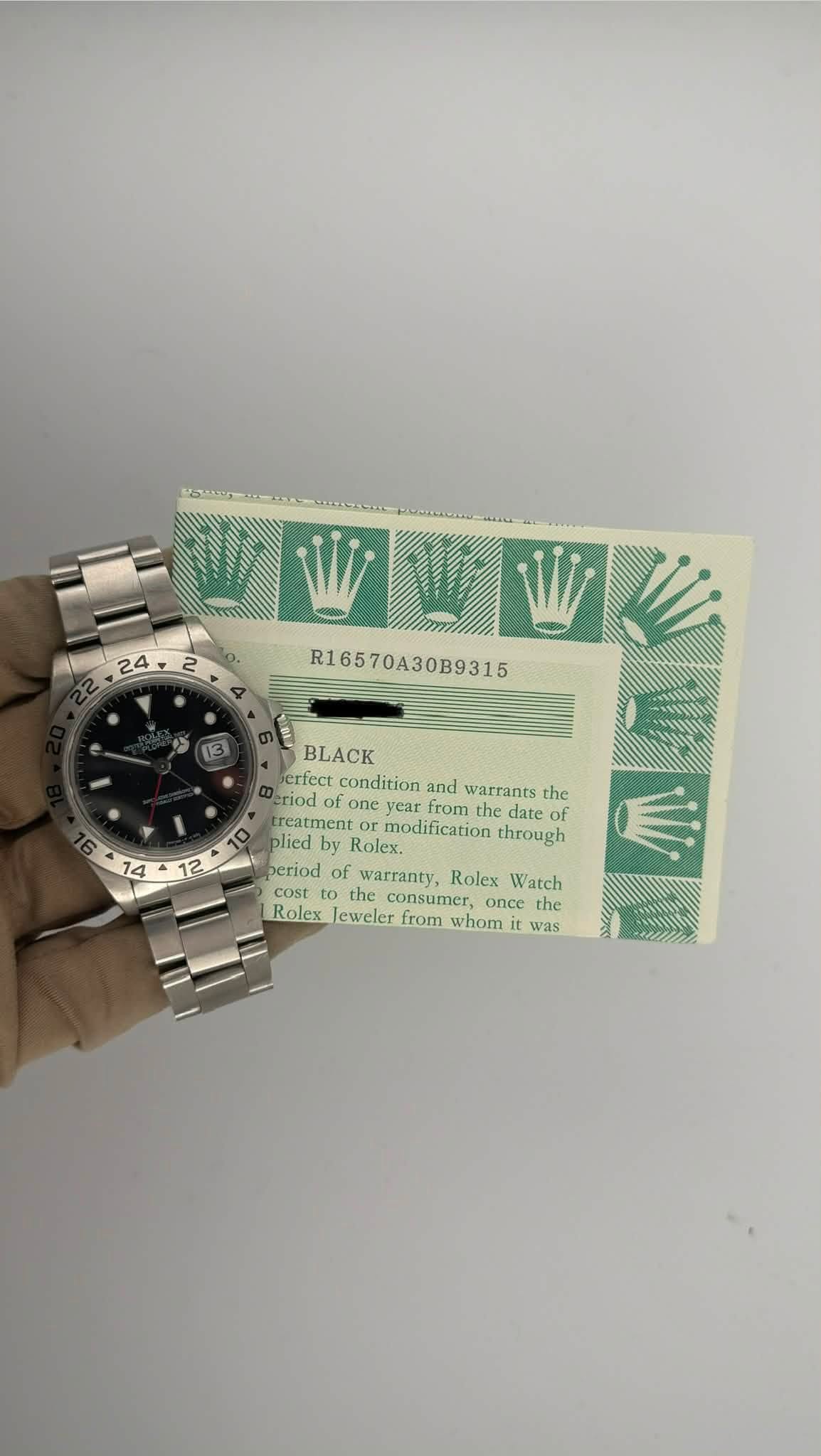 May be an image of wrist watch, ticket stub, money and text that says ' R16570A30B9315 (13 12 BLACK crfect condition and warrants the eriod fone yc from the date of reatment…