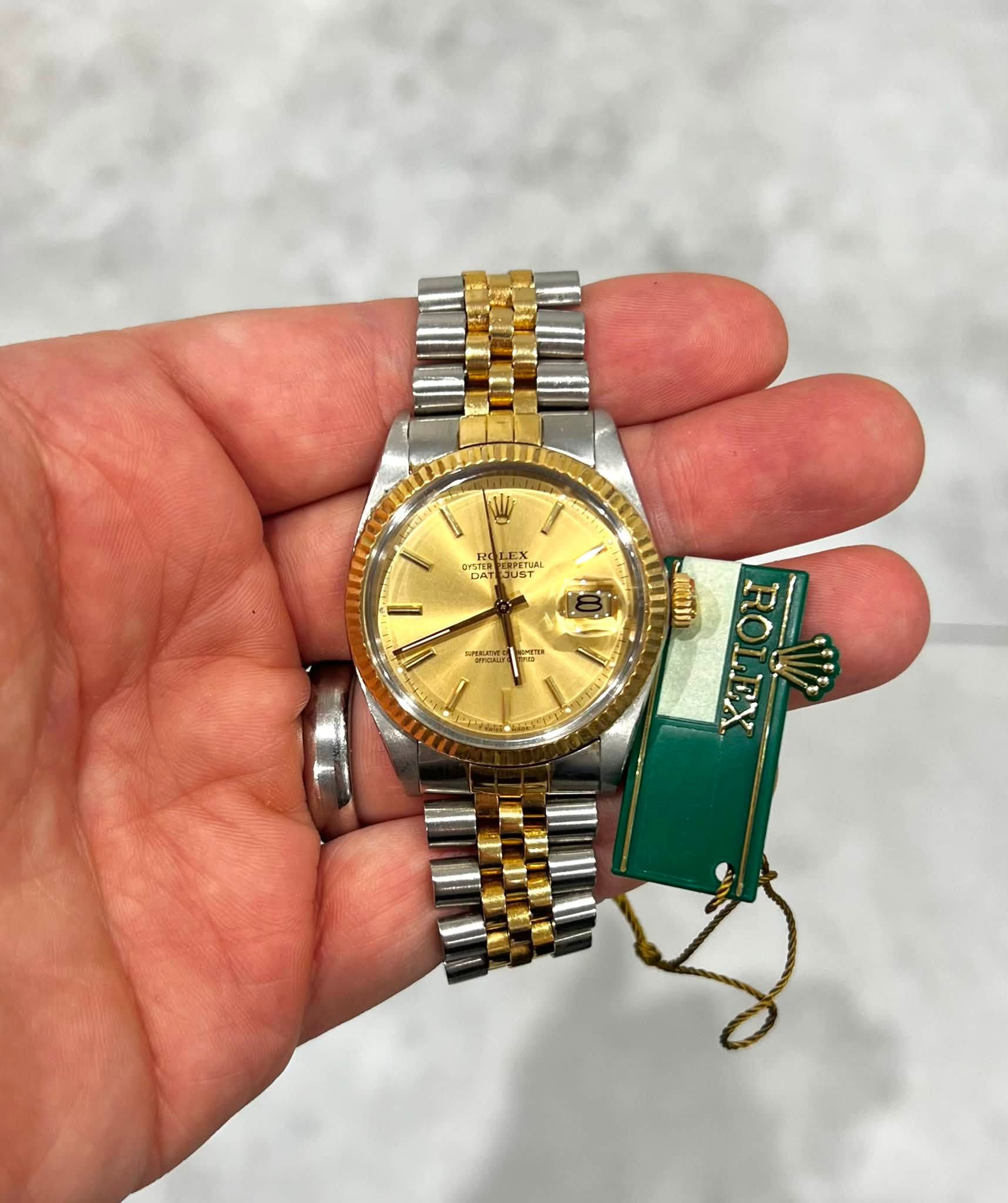 May be an image of wrist watch and text