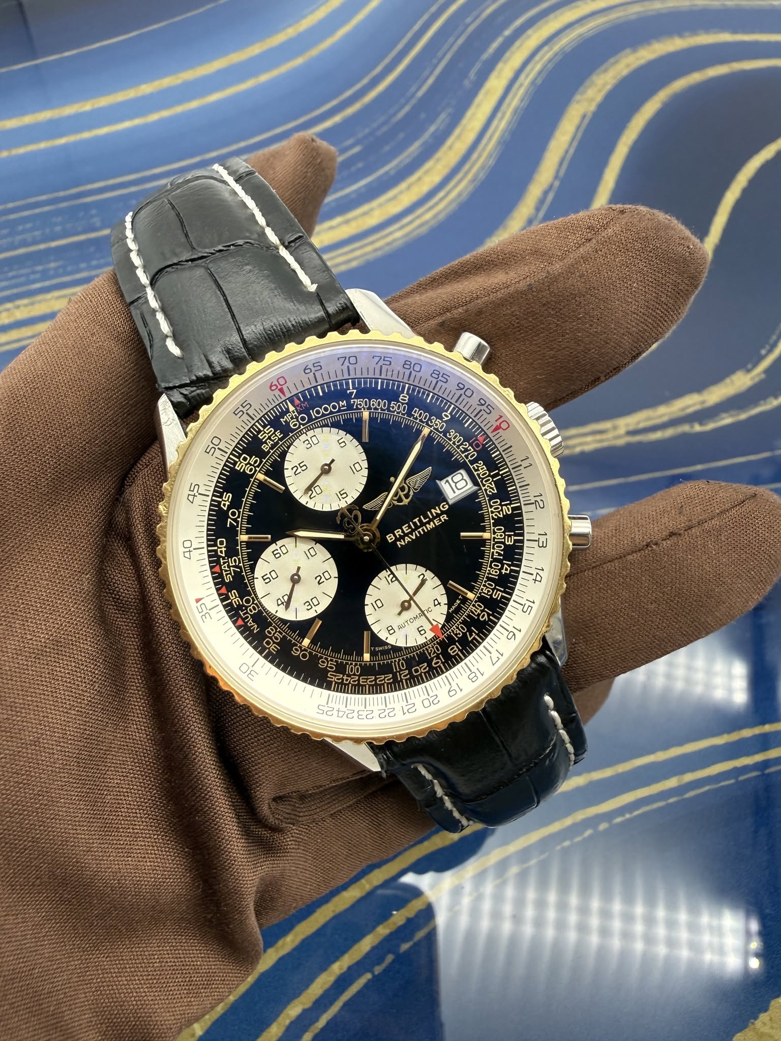 May be an image of wrist watch and text