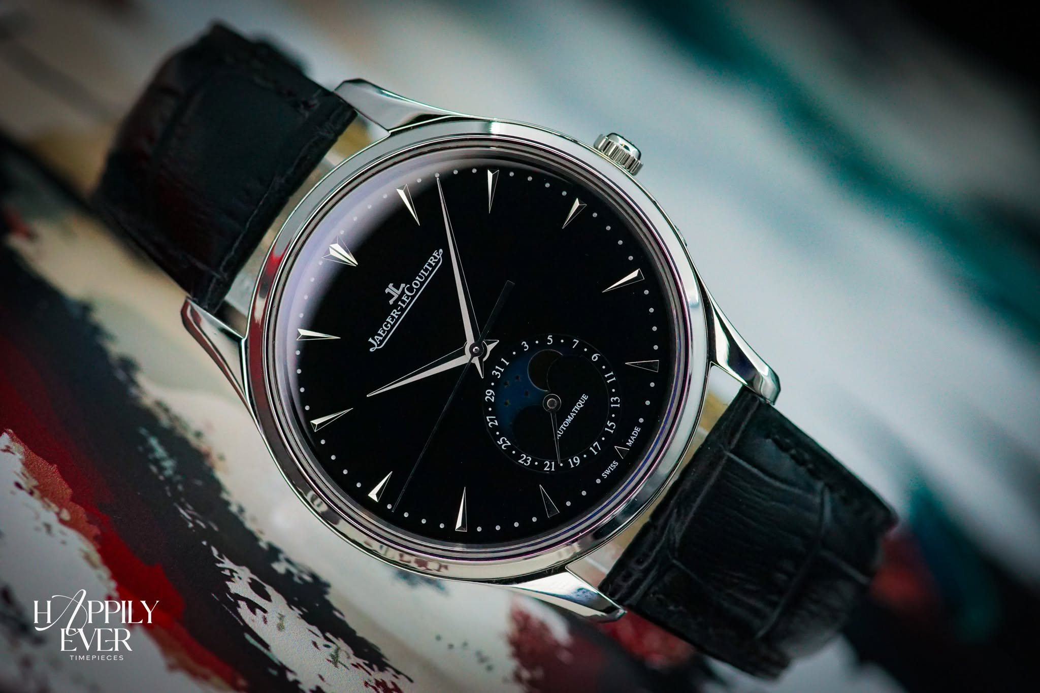 May be an image of wrist watch and text that says 'I TECOULTRE JAEGER 6 311 ង 7 د 25 ΑυΤOΜATИΣ 23 21 7 MADE SWYTSS 19 H HAPPILY EVER TIMEMIECES องย'