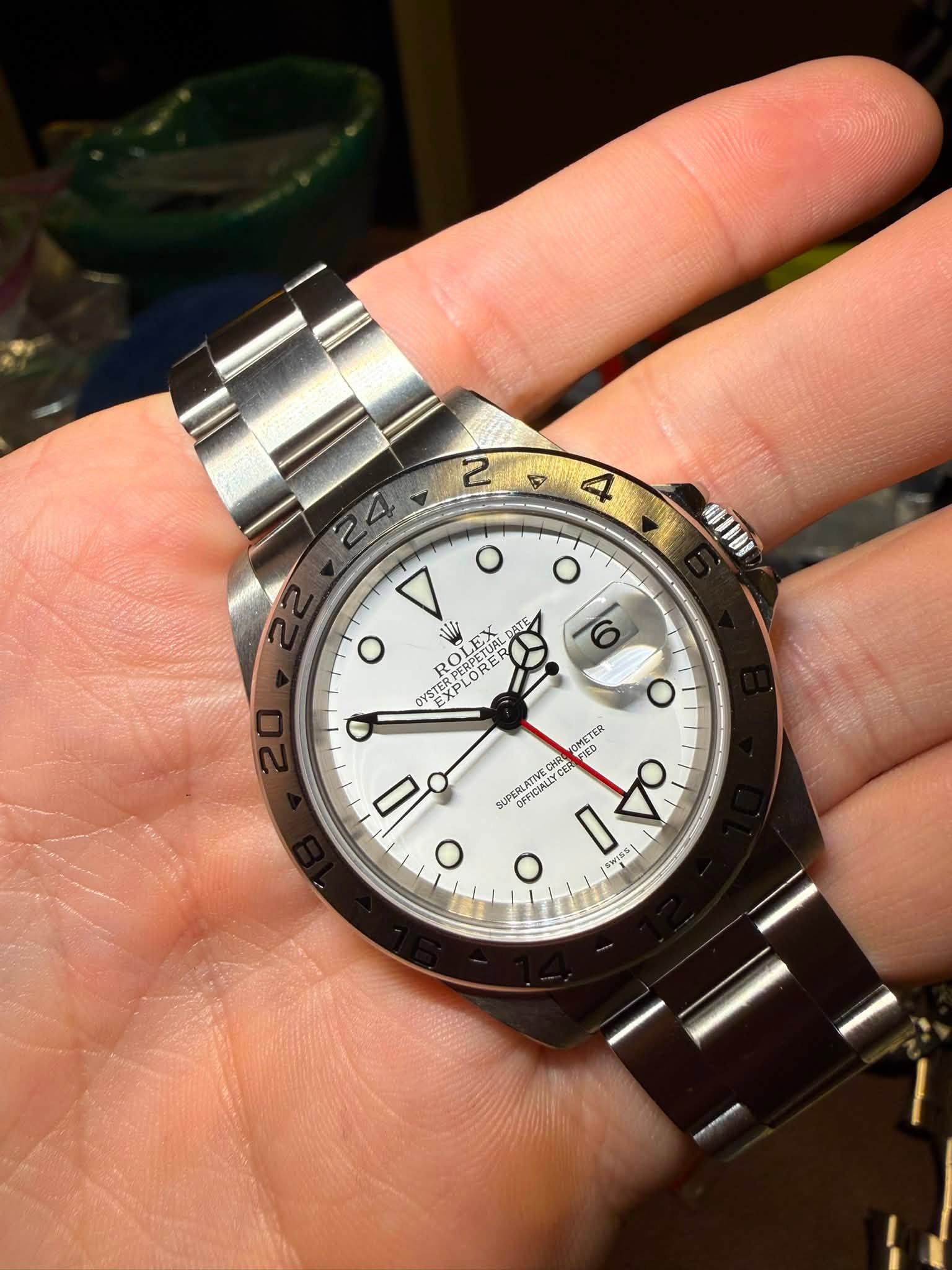 May be an image of wrist watch and text that says '2 5 4 WDDI o YSTULORE EXP VI TI DYSTERPE RO OC PERPETUAL PLOF OYSTER OMETER 0 SUPERLATIVED RENCIALLYCE OチFCALAY O O FFICIALLY 1…