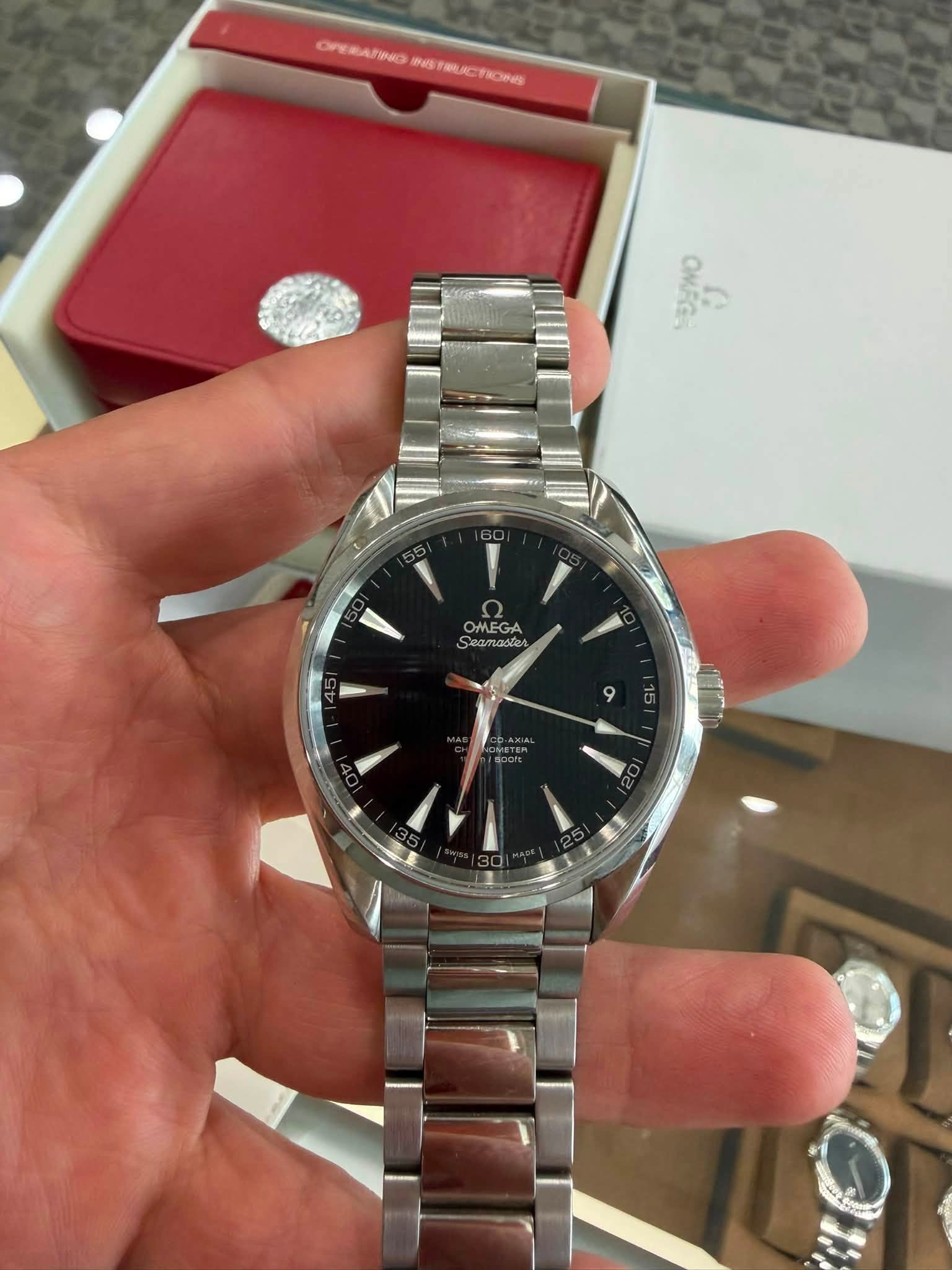 May be an image of wrist watch and text
