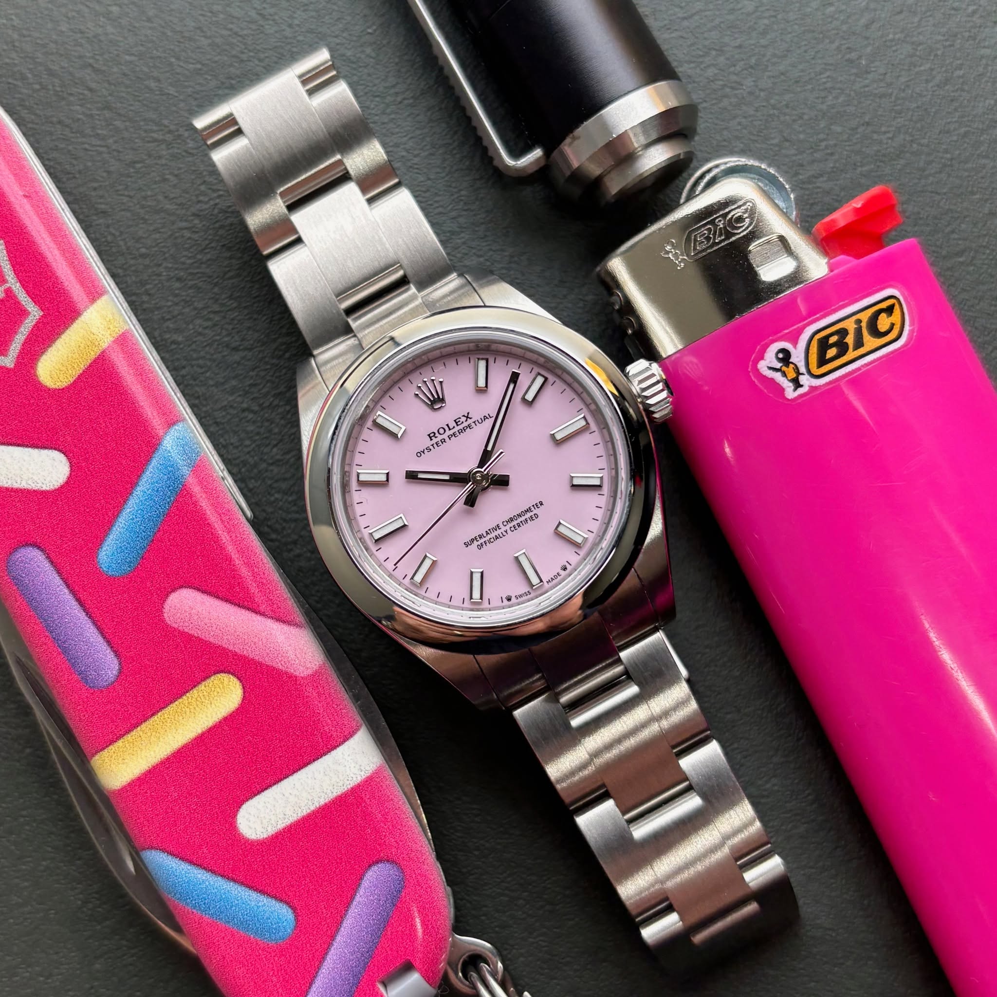 May be an image of wrist watch and lighter