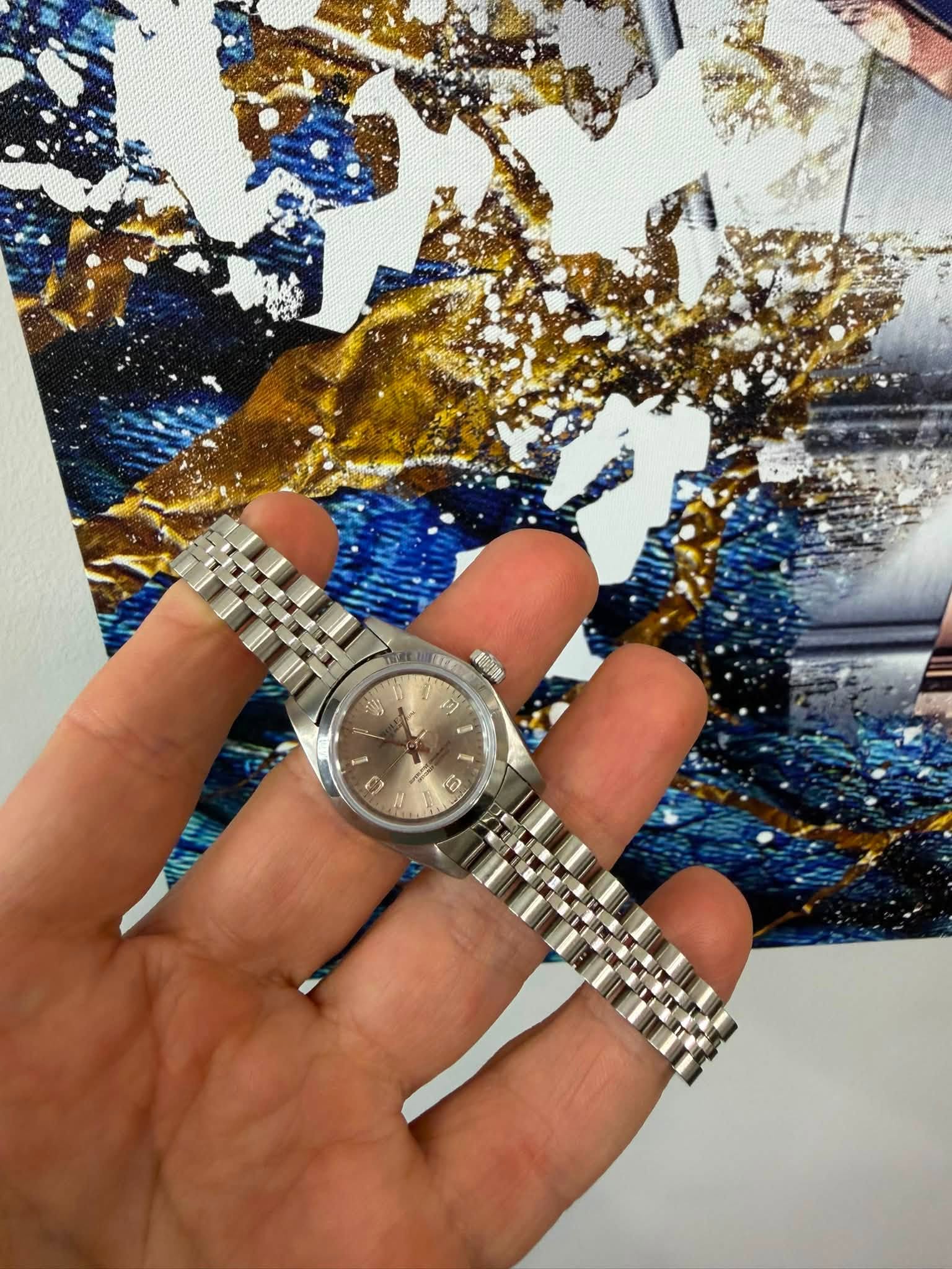 May be an image of wrist watch and text that says '- S'