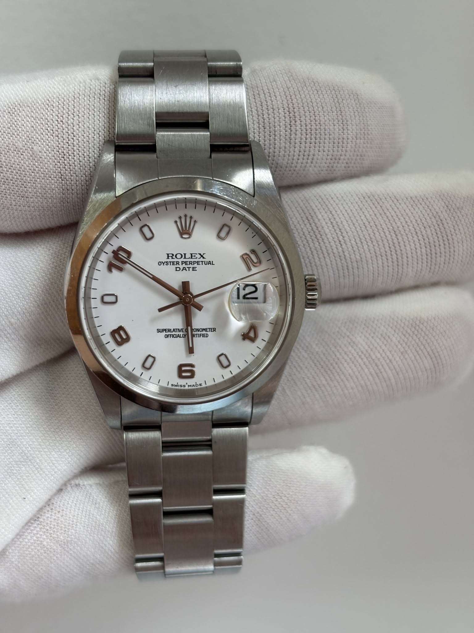 May be an image of wrist watch and text