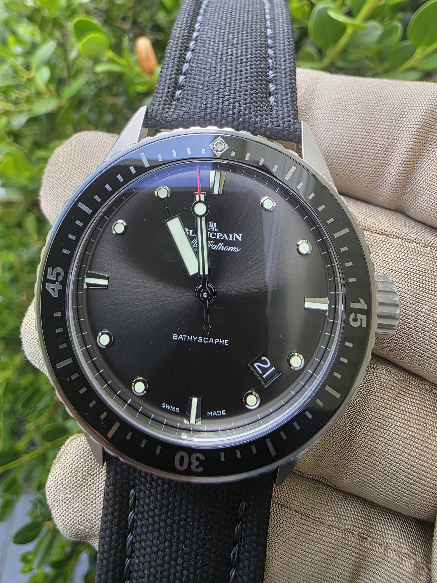 May be an image of wrist watch and text