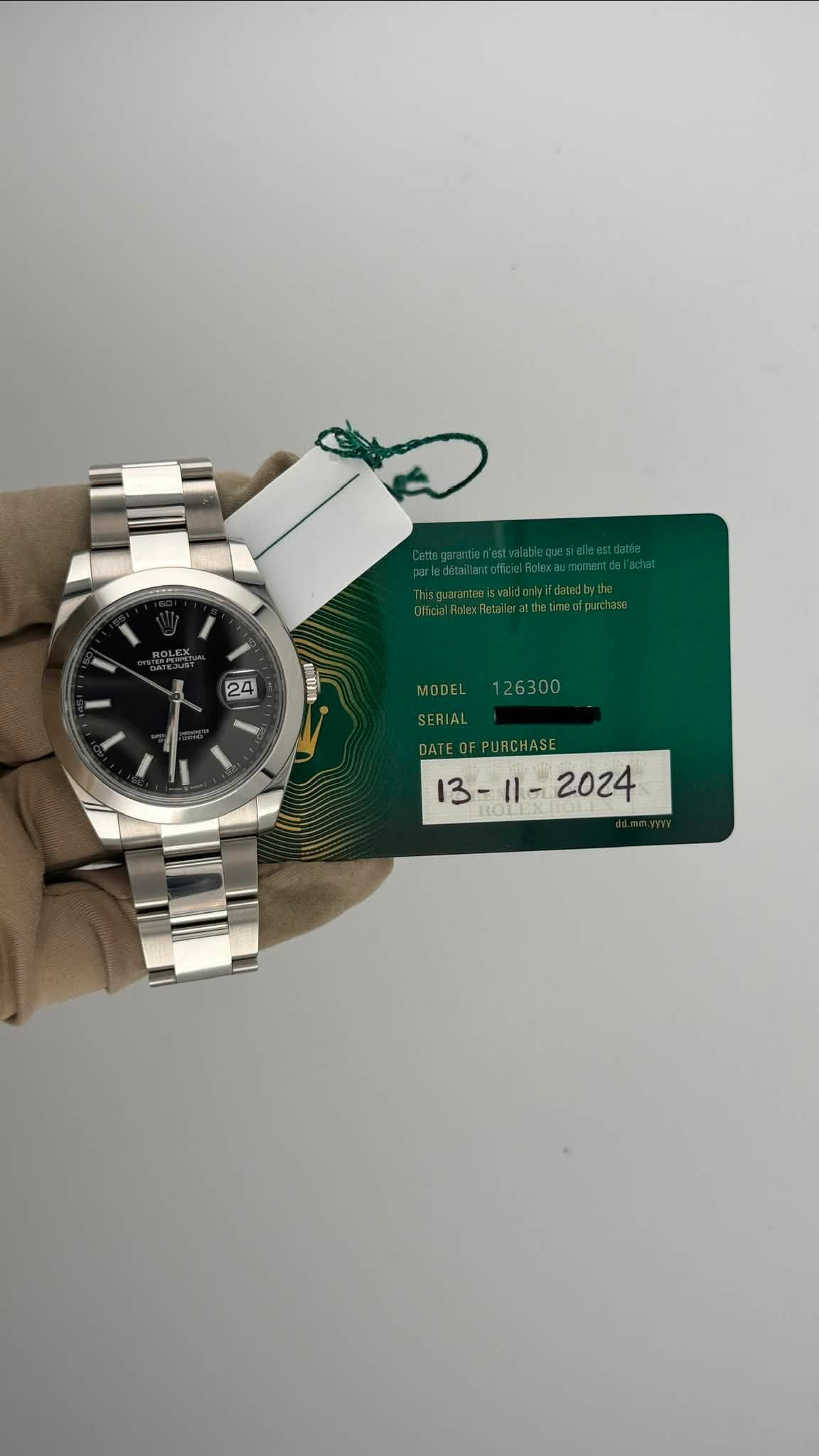 May be an image of wrist watch and text that says '24 0 MODEL SERIAL 1l- 2024 13-1l- 13'