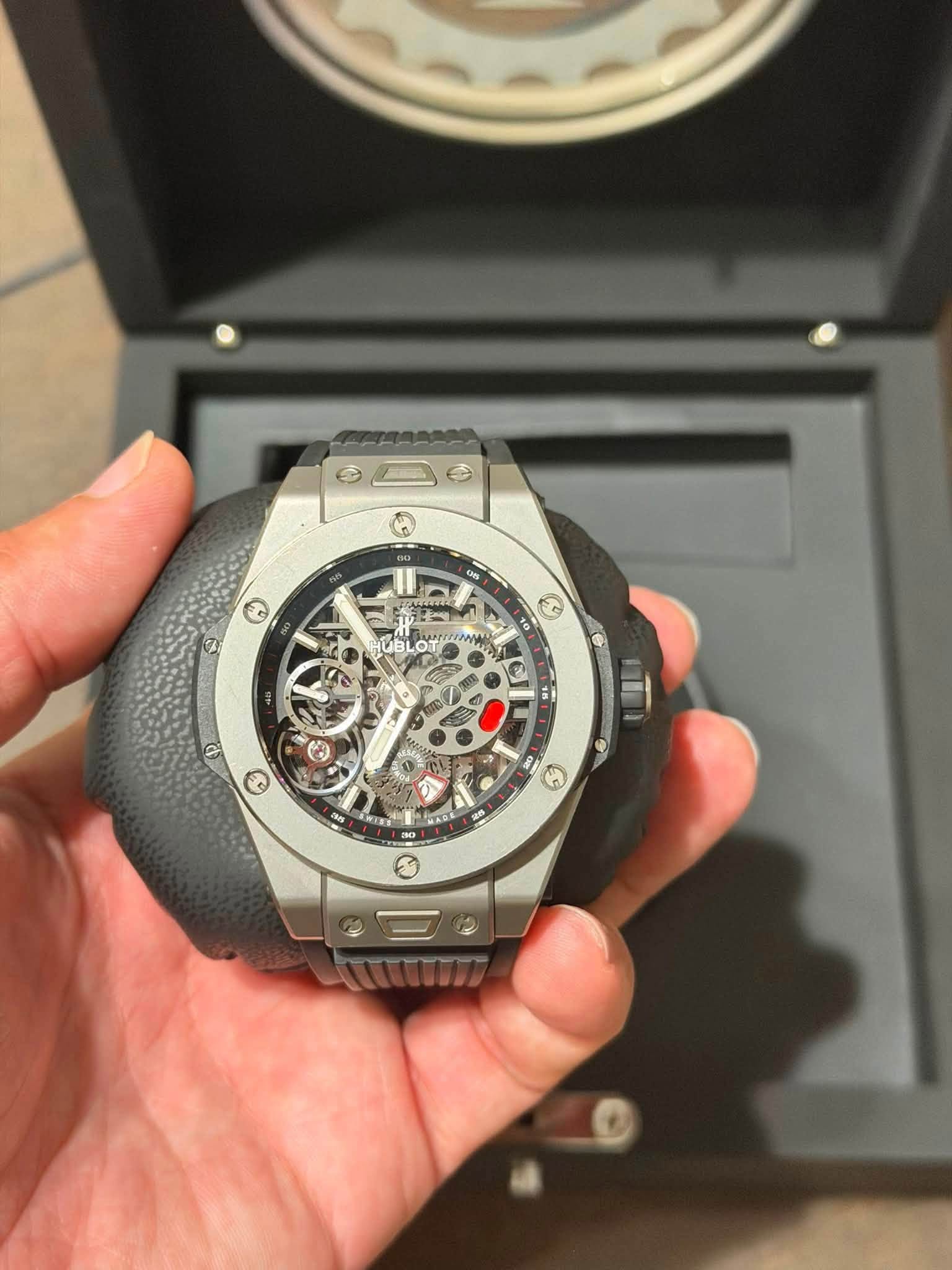 May be an image of wrist watch and text