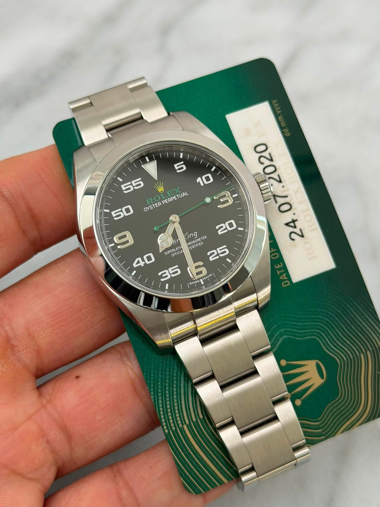 May be an image of wrist watch and text