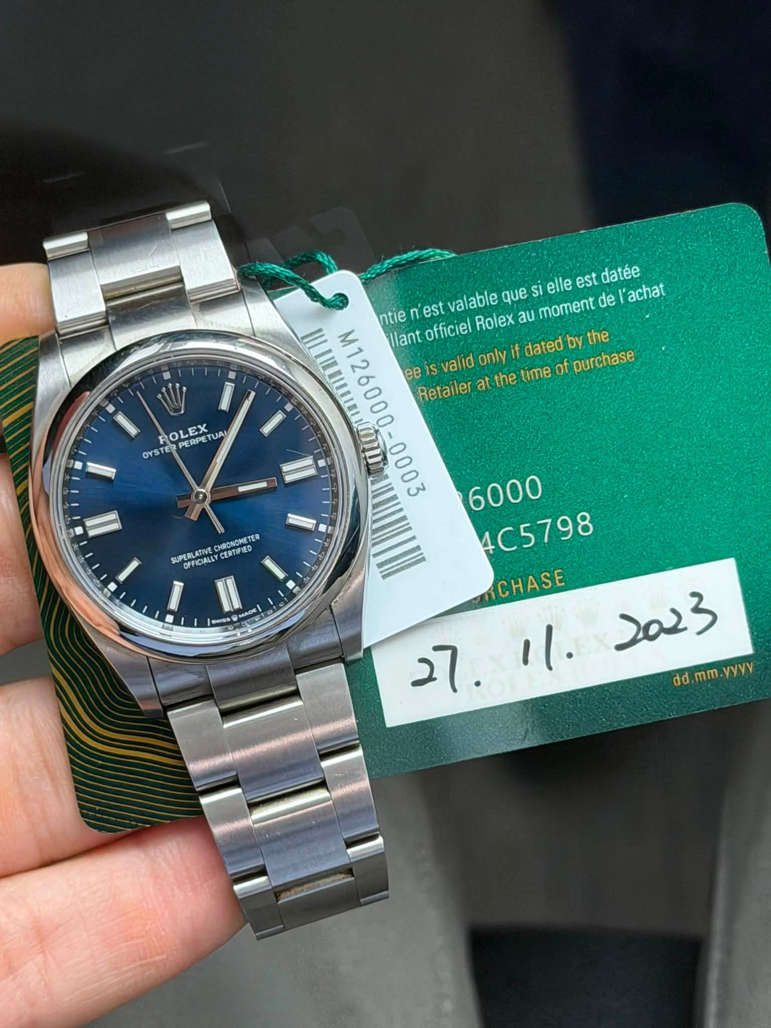 May be an image of wrist watch and text that says 'ROLEX PERPE PERPET RPET UAN OYST OYSTER que si elle est datée M126000-0003 M1 llant ntie ก est valable Rolex au moment de…