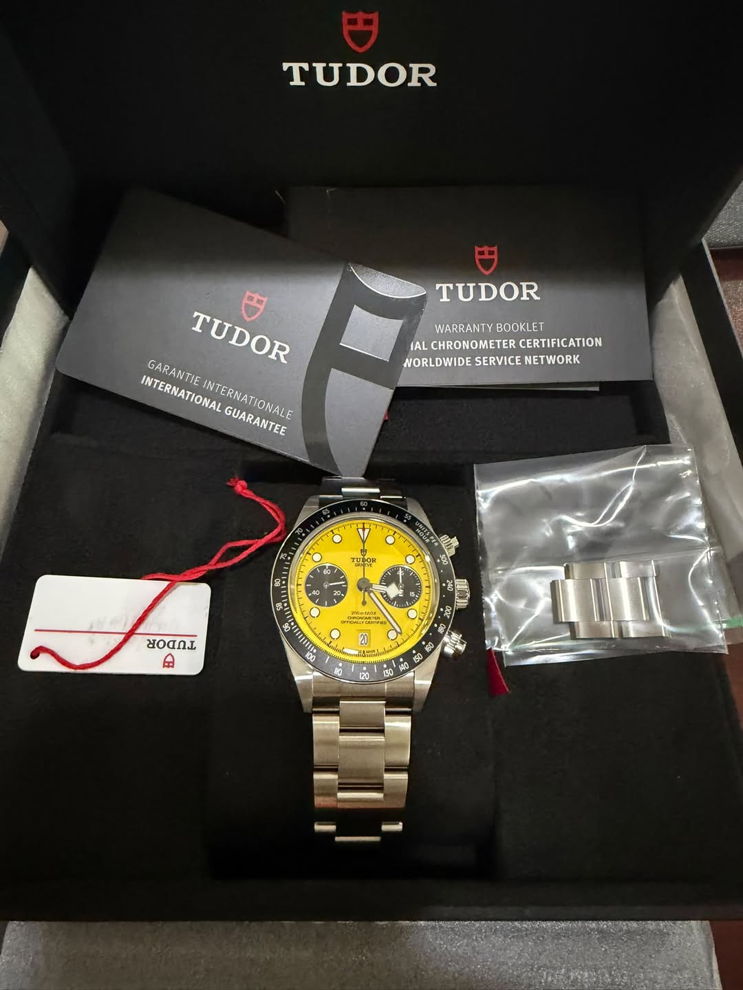 May be an image of wrist watch and text that says 'TUDOR TUDOR WARRANTY BOOKLET IAL IALCHRONOMETERCERTIFICATIO CHRONOMETER CERTIFICATION WORLDWIDESERVICE.NETWORK WORLDWIDE…