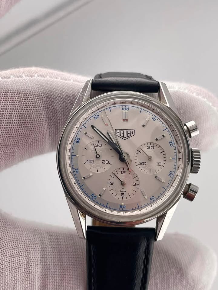 May be an image of ‎wrist watch and ‎text that says '‎ HEUER 160 I に و Of 3- T 二 / 6 4o O‎'‎‎