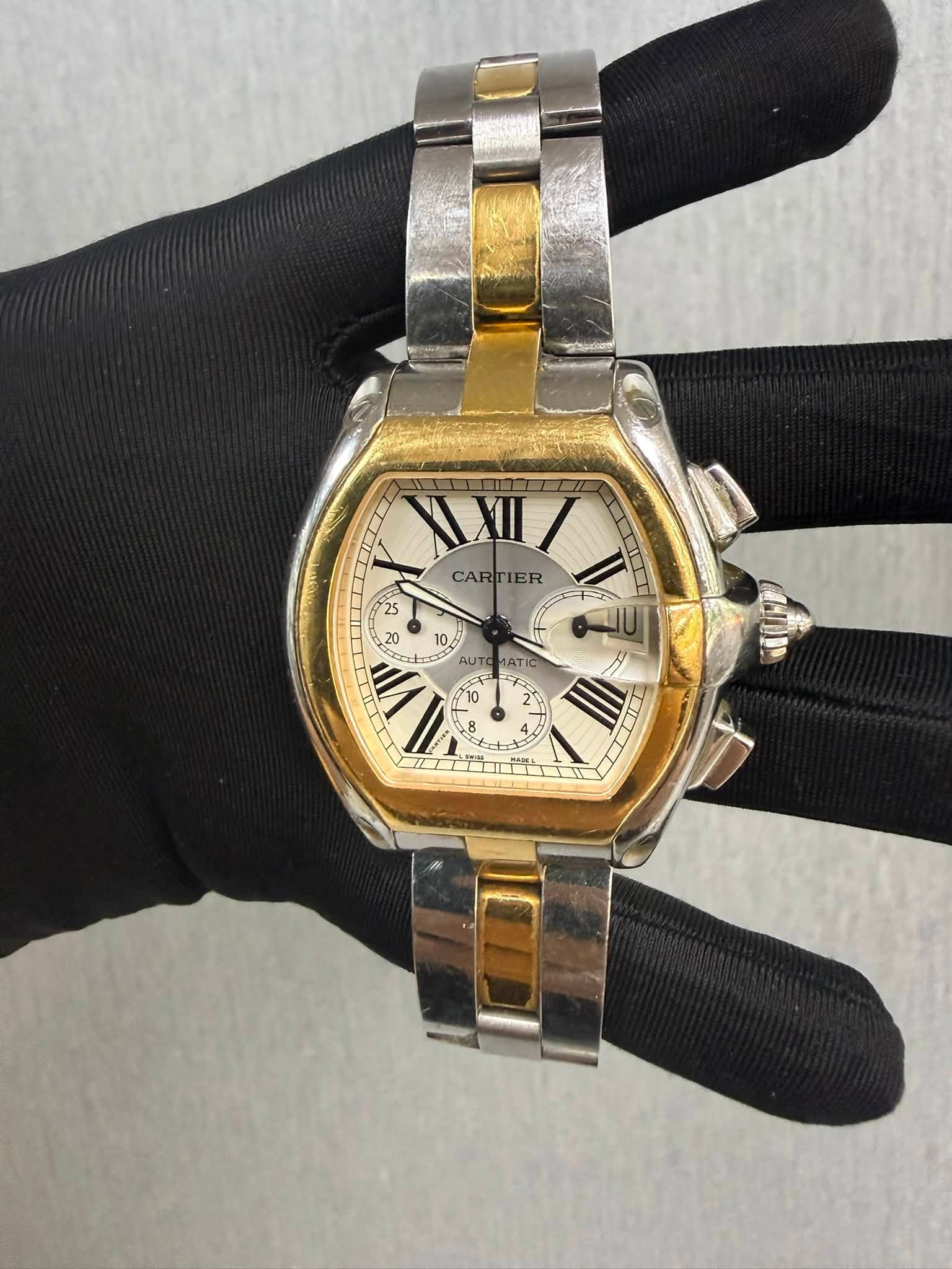May be an image of wrist watch and text that says 'VXII IT CARTIER IER CAR 日目 V AUT 10 8 8 AT ATIC K0T II I A I'
