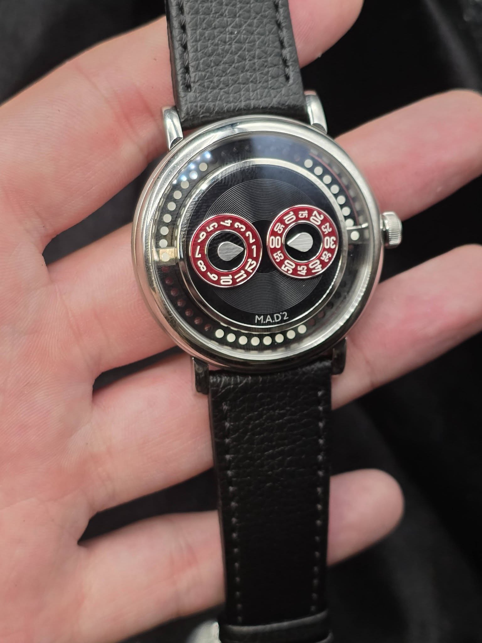 May be an image of owl, wrist watch and text that says 'ب من 3 D G 4 σε ک - 8 O ٥ 05 5 三 0 5X 55 50 e E 2 0 I 1 ባካ M.A.D2'