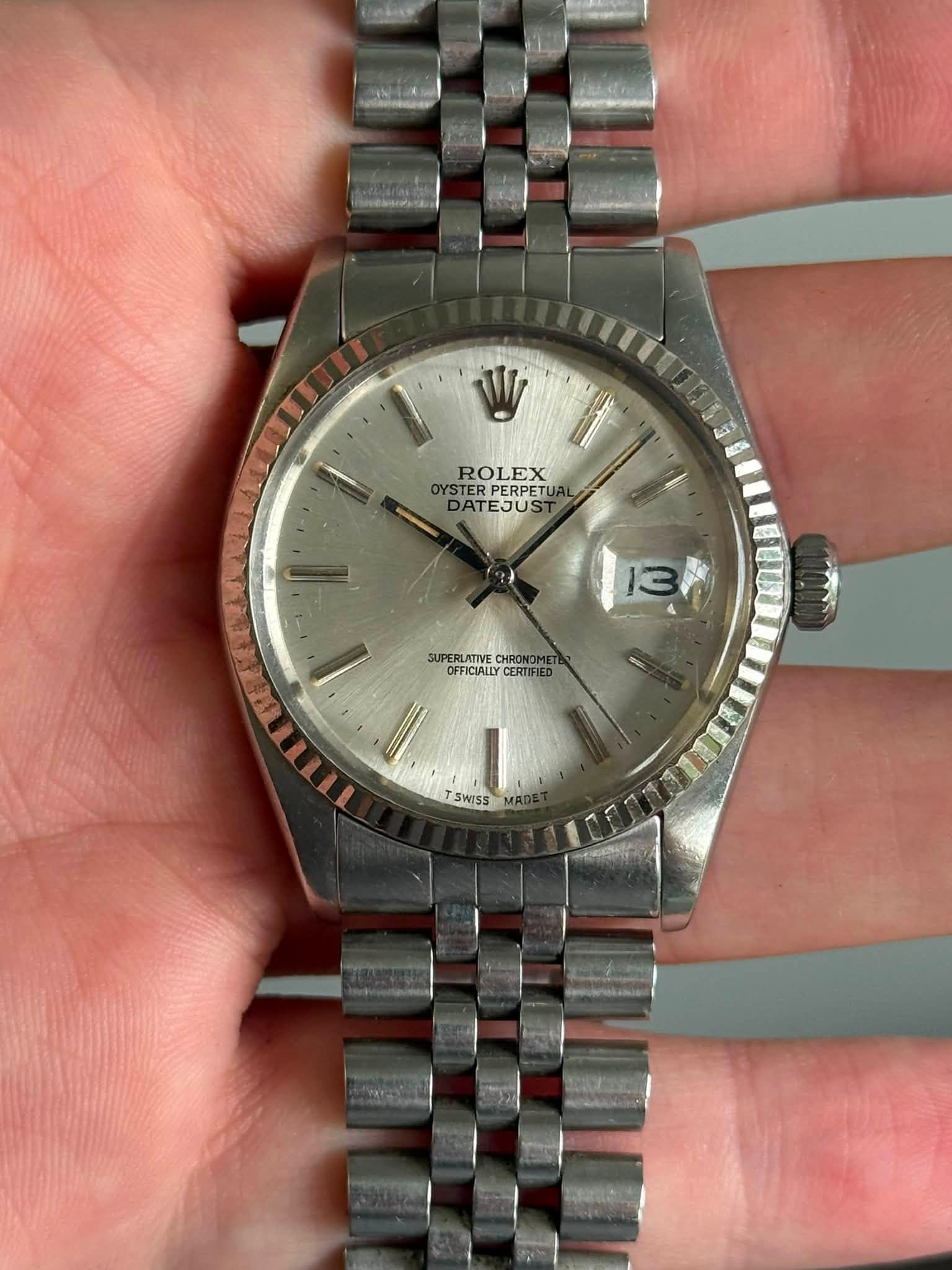 May be an image of wrist watch and text