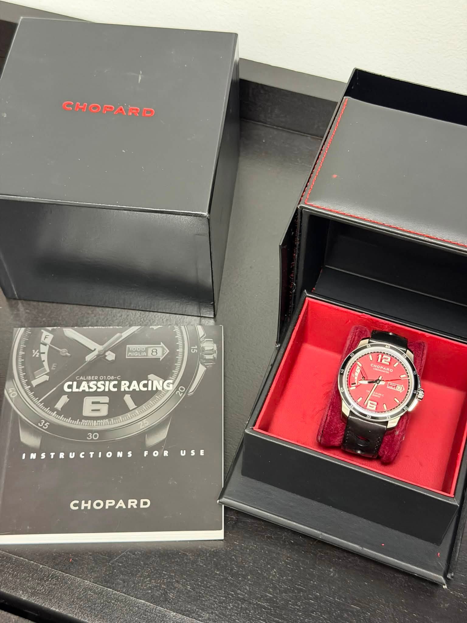 May be an image of wrist watch and text that says 'CHOPARD 子 SOLIA CALIBERG CLASSICRACI 106-C RACIN CLASSIC 6 35 sbaub.mormsatai 30 INSTRUCTIONS 12 cHoeaRe ลค 6 FOR USE CHOPARD'