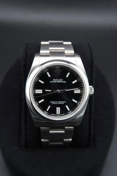 May be an image of wrist watch and text that says 'ROLEX ROLEX EX ROL OYSTERPERPETUAL CYSTERFERPETUAL OYSTER UAL 45 MPERLAR 40 TB im 40 335 GY I E'