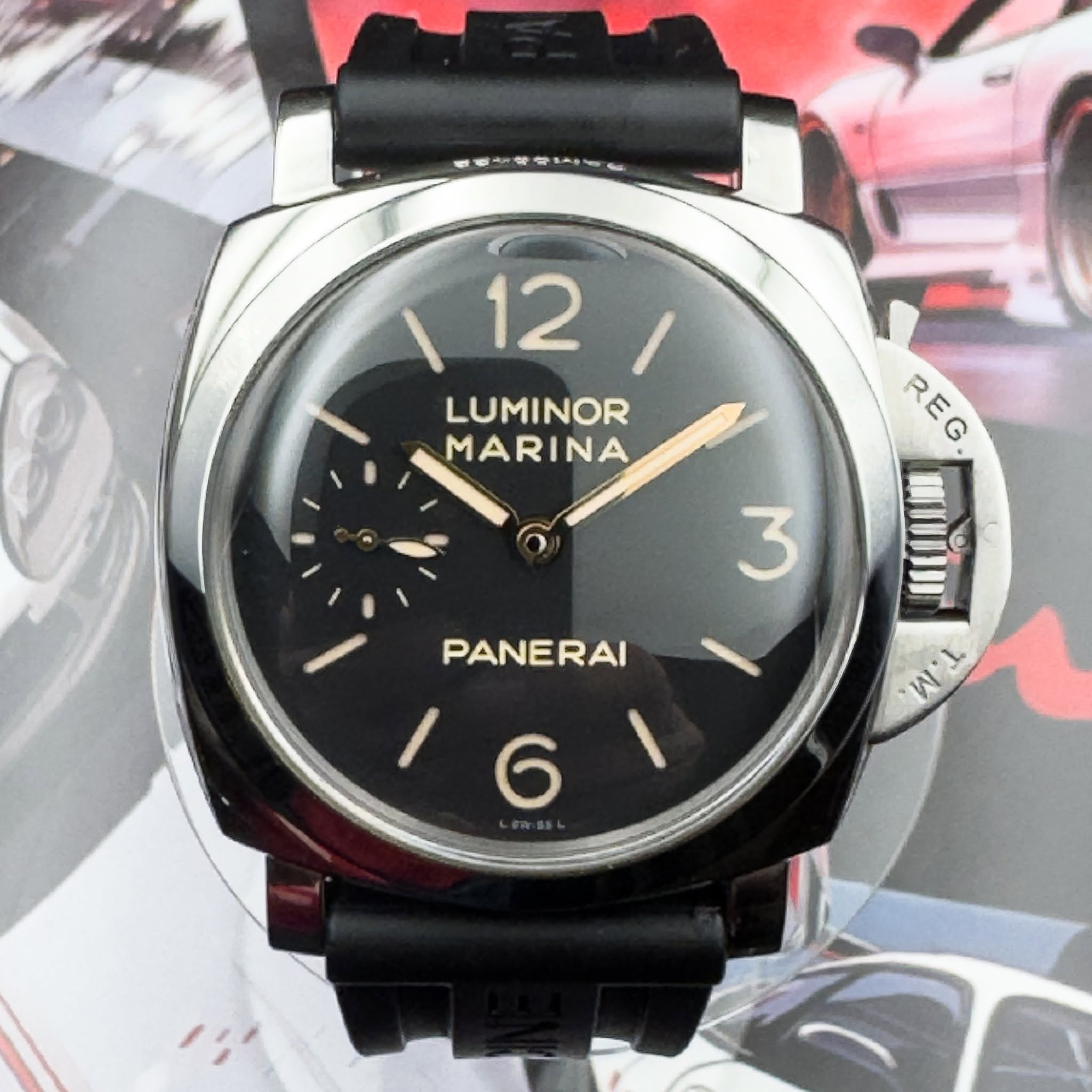 May be an image of wrist watch and text that says '12 12 LUMINOR MARINA REG R Iou O W'L 3 PANERAI 6'