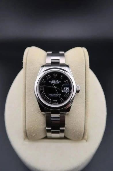 May be an image of digital watch and text
