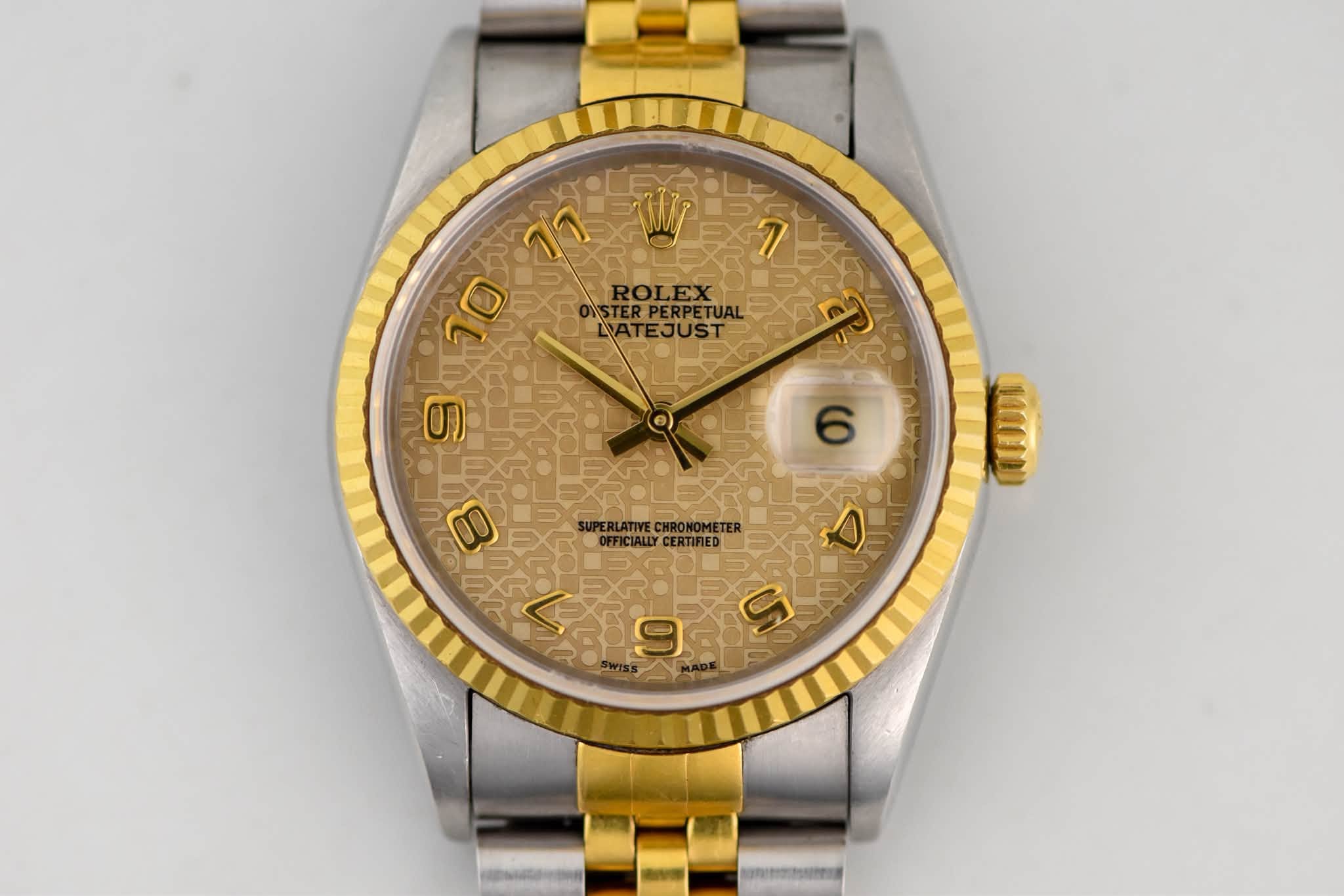 May be an image of wrist watch and text