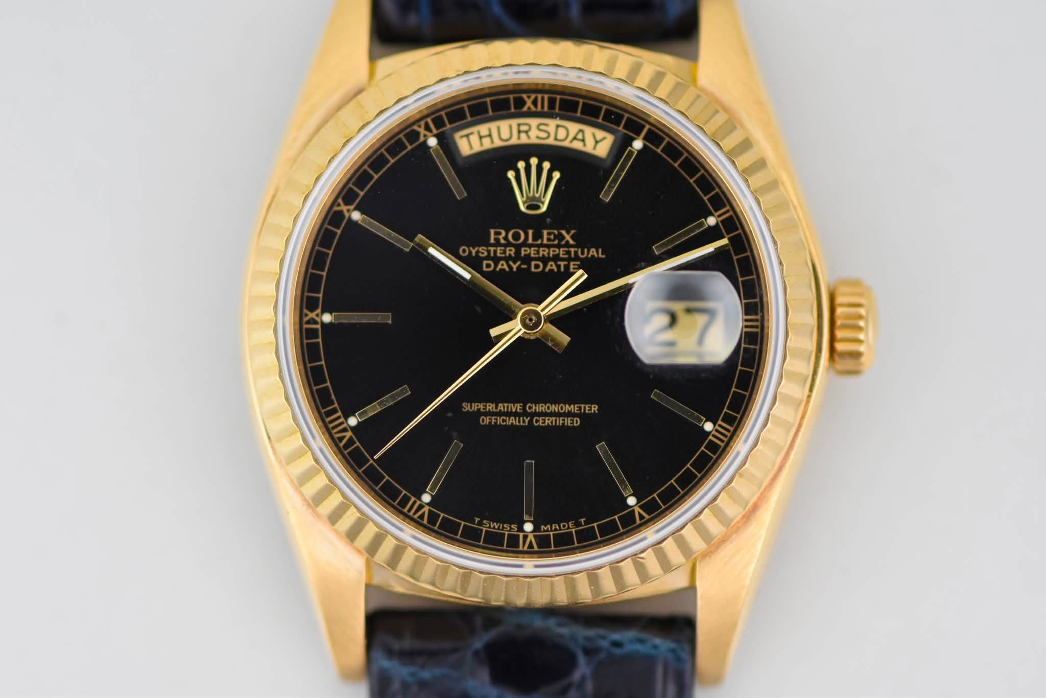 May be an image of wrist watch and text that says 'XII THURSDAY IRSDAY ROLEX STERP YSTERPERPETUAL ERPERPE DAY DAY-DAT AY 27 ATIVECHRONOMETER BALLYCERTIFIED'