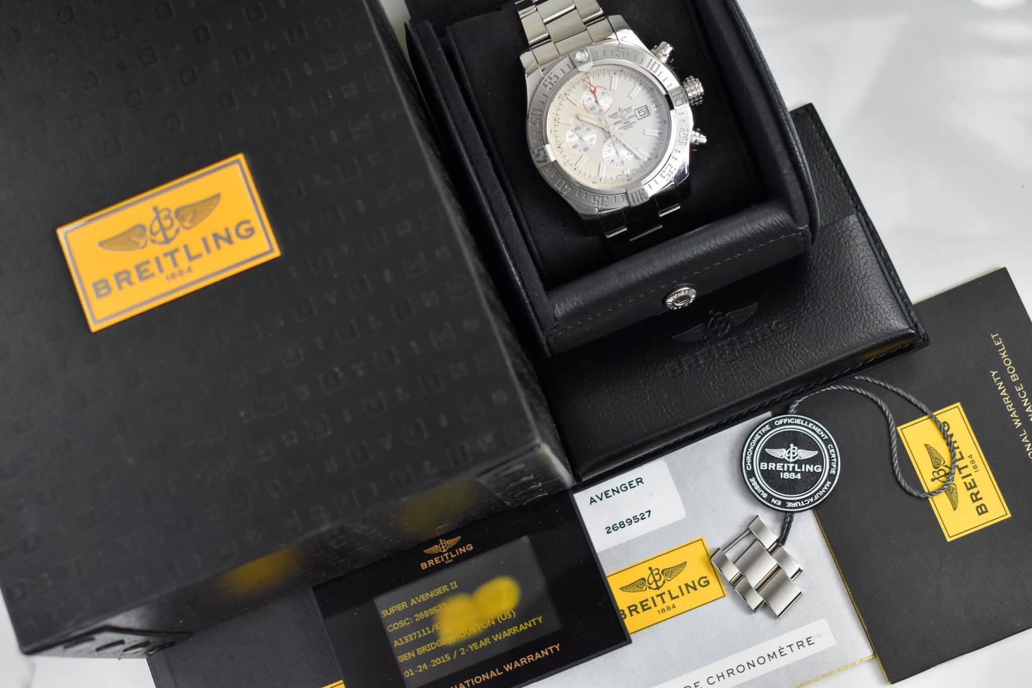 May be an image of wrist watch and text that says 'D PREITLING BREITLING 1004 0 BOOKLET CnCME BREITLING REIT REITLI ITLI 1804 LIN ING AVENGER 2689527 นนวา እ3ዊ 1804 B REITLING 084 E…