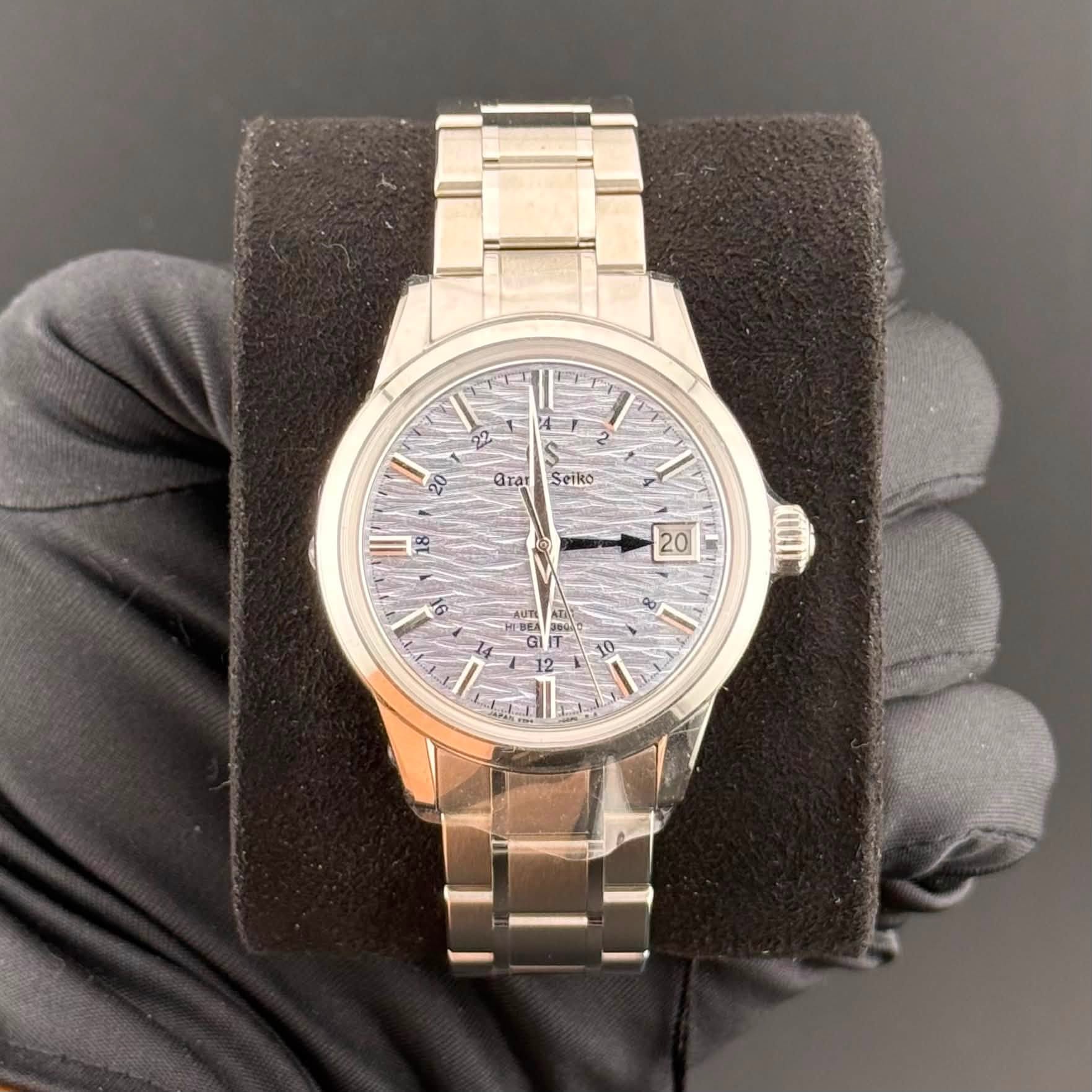May be an image of wrist watch and text