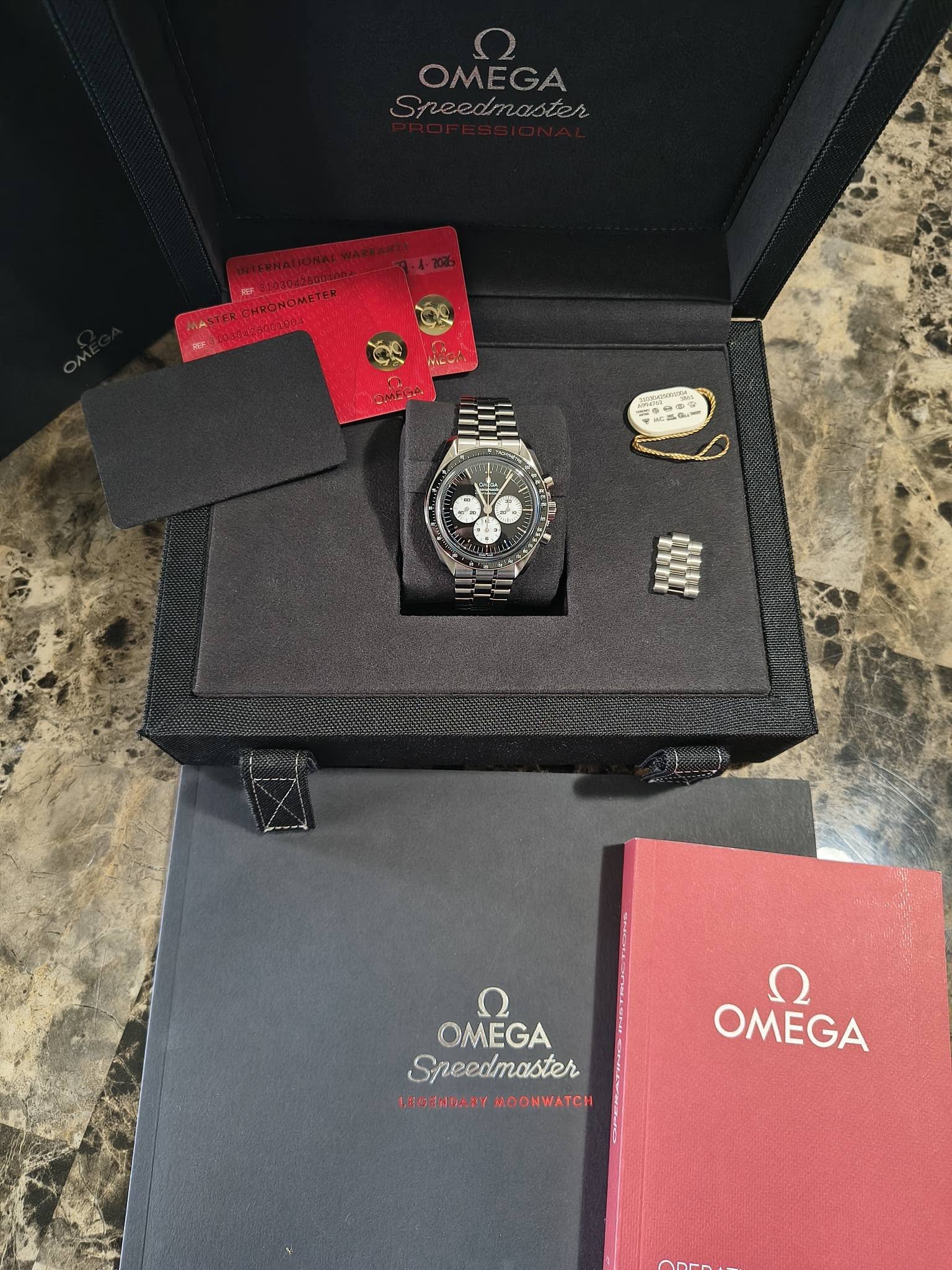 May be an image of cufflinks, wrist watch and text