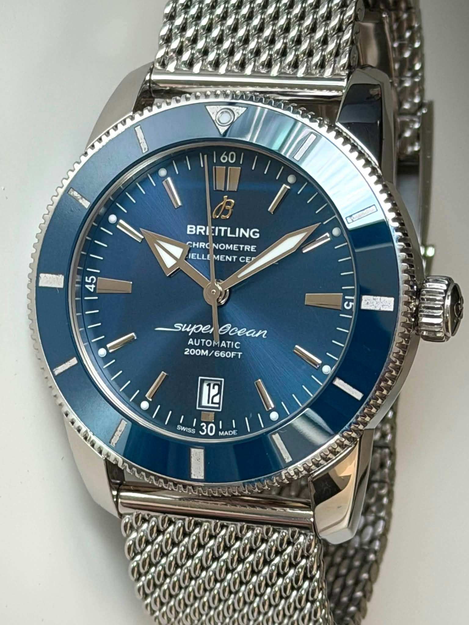 May be an image of wrist watch and text that says '60 BREITLING CHRO NOMETRE RE IELLE MENT ELLEMENTCE C CE 45 I super ecean AUTOMATIC 200M/ 200M/660FT 660FT ا 12 SWISS 30…