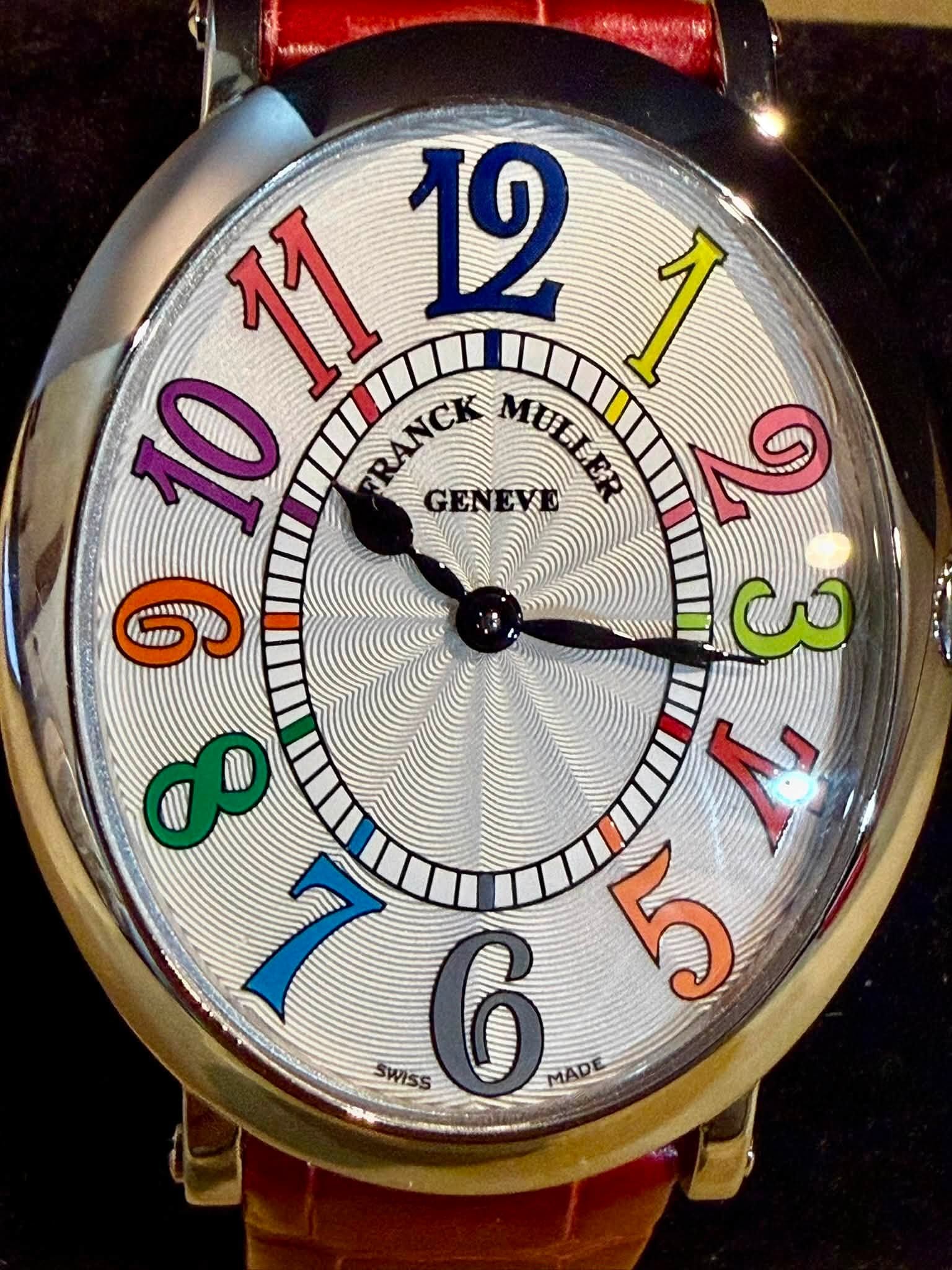 May be an image of ‎wrist watch and ‎text that says '‎HENAo ጃኝ II 11 12 I RANCK GENEVE MULLER RANCK 9 ယဲ ジ ل MADE ሞ 1I SWISS‎'‎‎