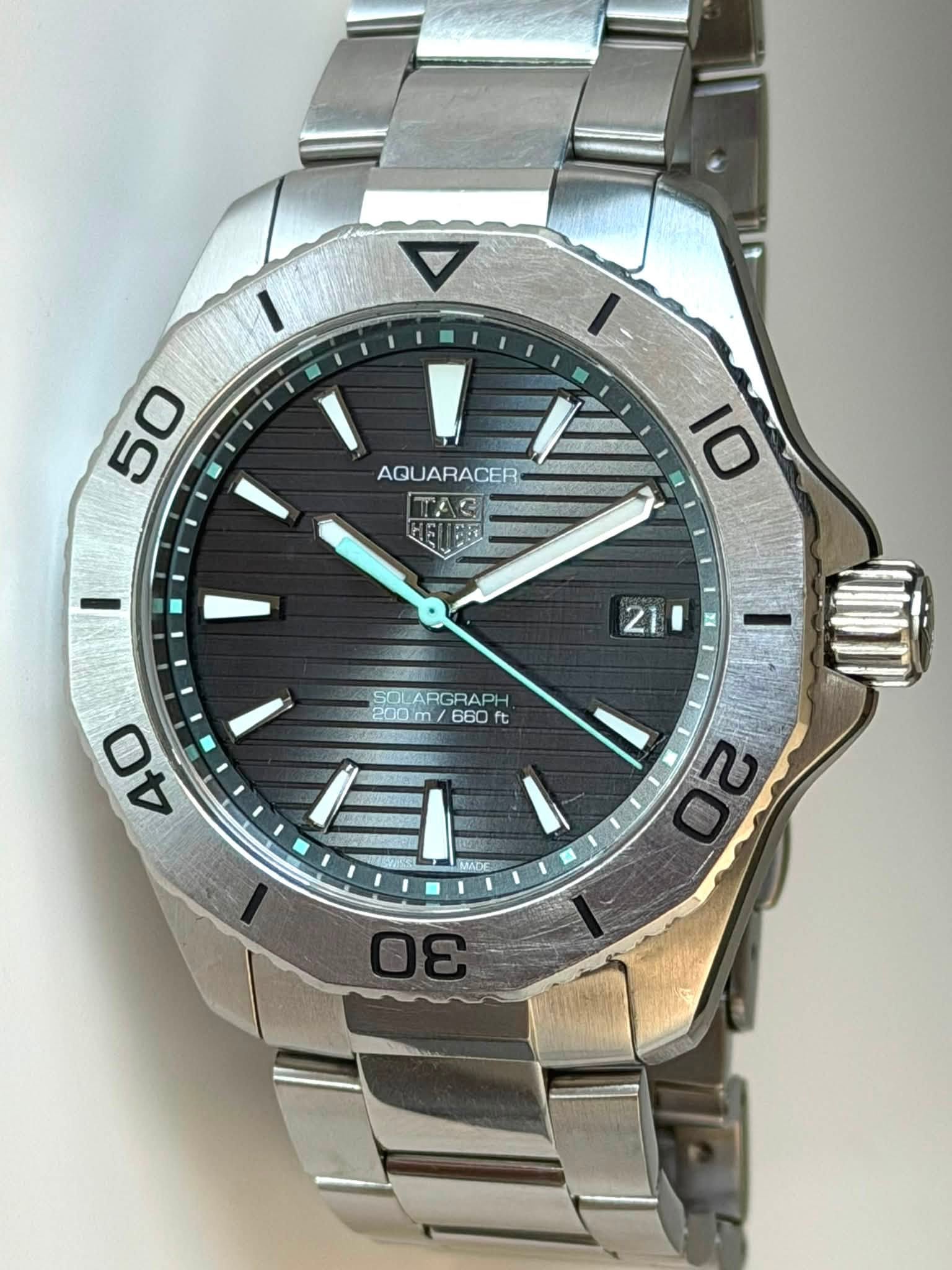 May be an image of wrist watch and text that says '50 AQUARACER AQU 10 21 I SOL SOLARGRAPH 200m 660 ft 200mm/660t ft 40 WA 20 ខ'