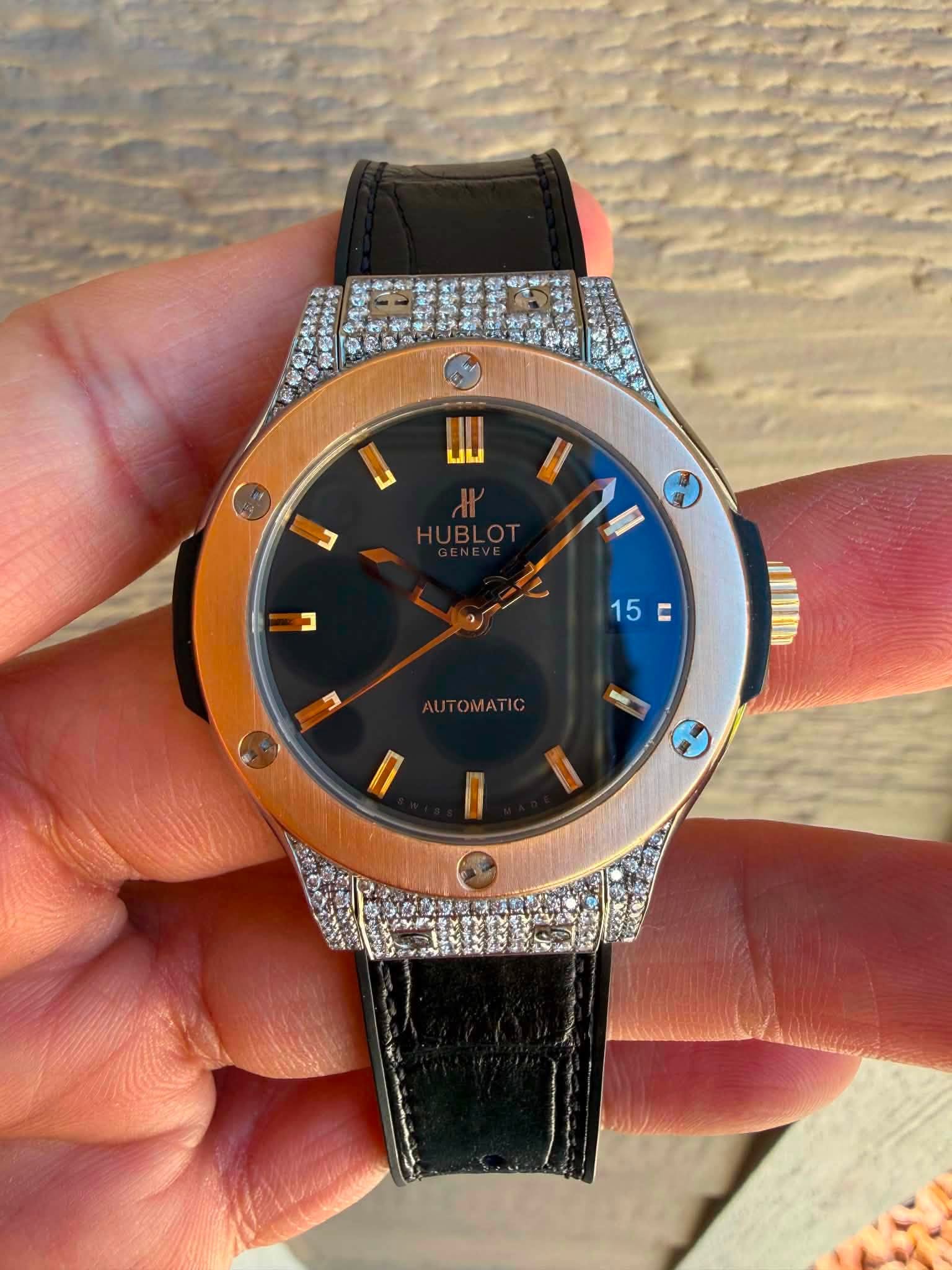 May be an image of wrist watch and text that says 'иO UIL บ II ב 15C E E 15 E UTOMATIC +'