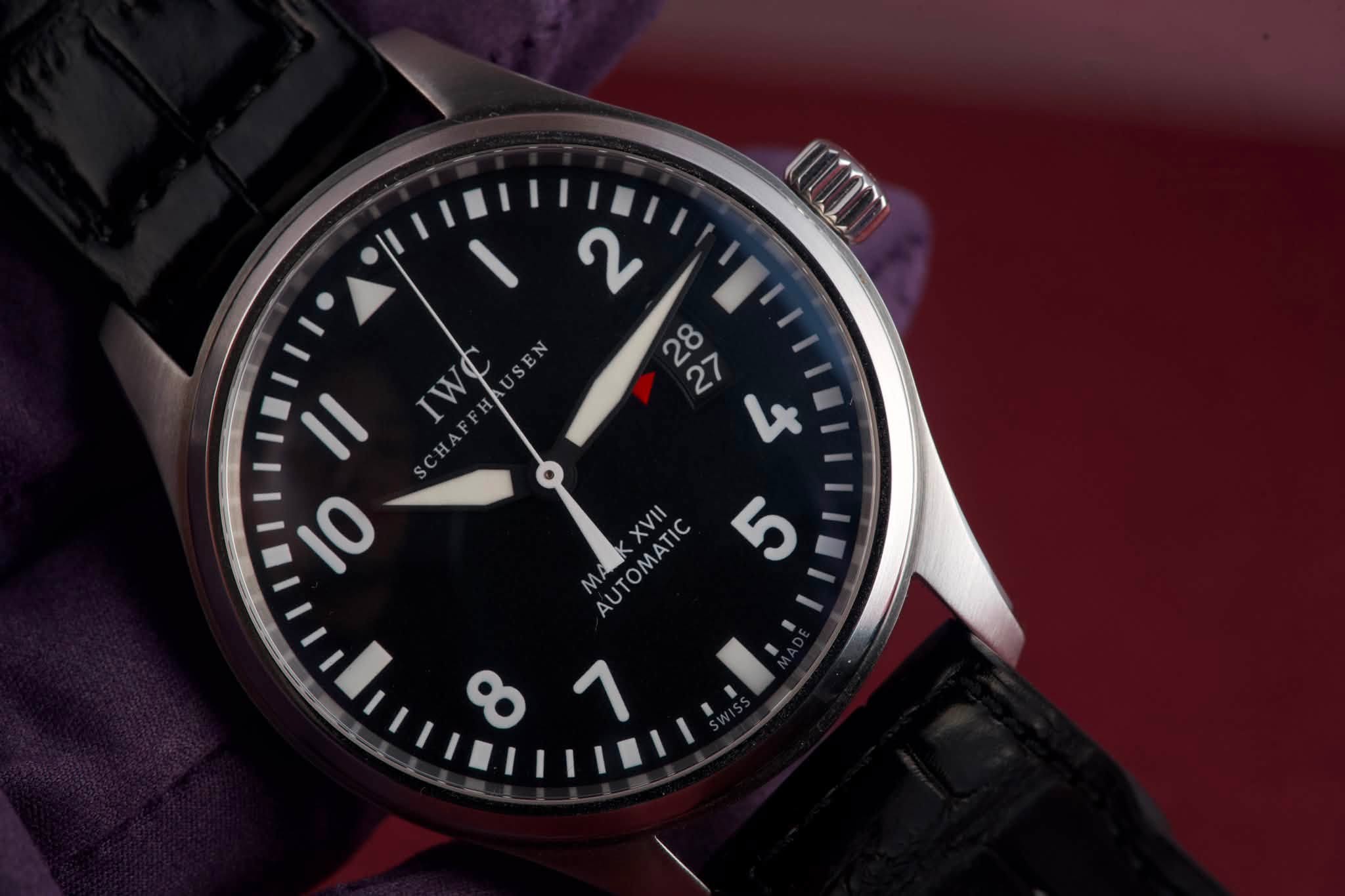 May be an image of wrist watch and text that says 'UT ن ពុលុ IWO SEN S 0 M K AUTOMATIC XVII $ 8 1'