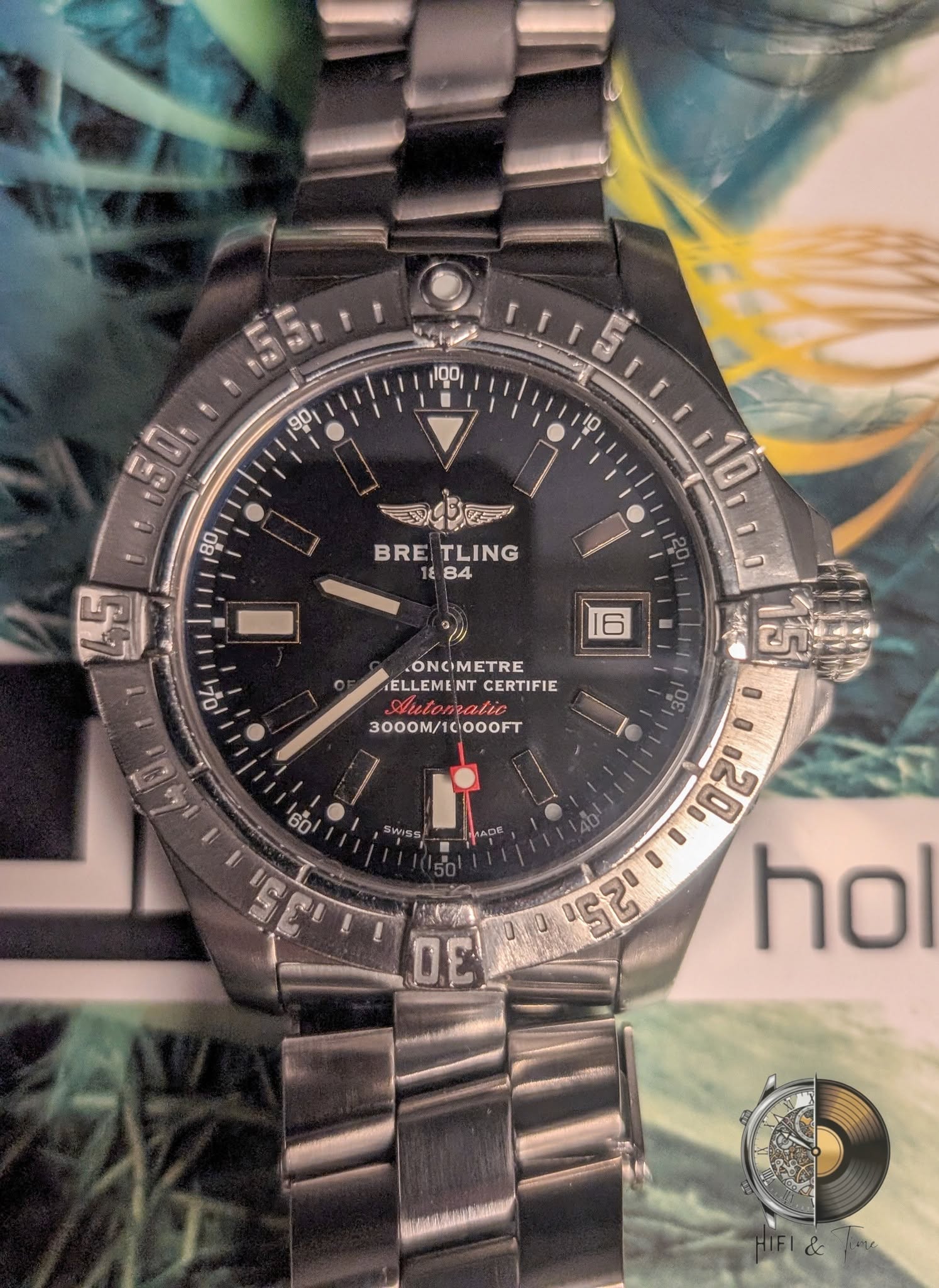 May be an image of digital watch and text that says ' 阿 BRETLING 18 84 BRE TLING 맘 10TL0 ONOIMETRE ELLEME CERTIFIE Nutomatic 3000M/10000FT OOOFT . 60/ SWISS AD 00 00120 DE Ονα 0 25…