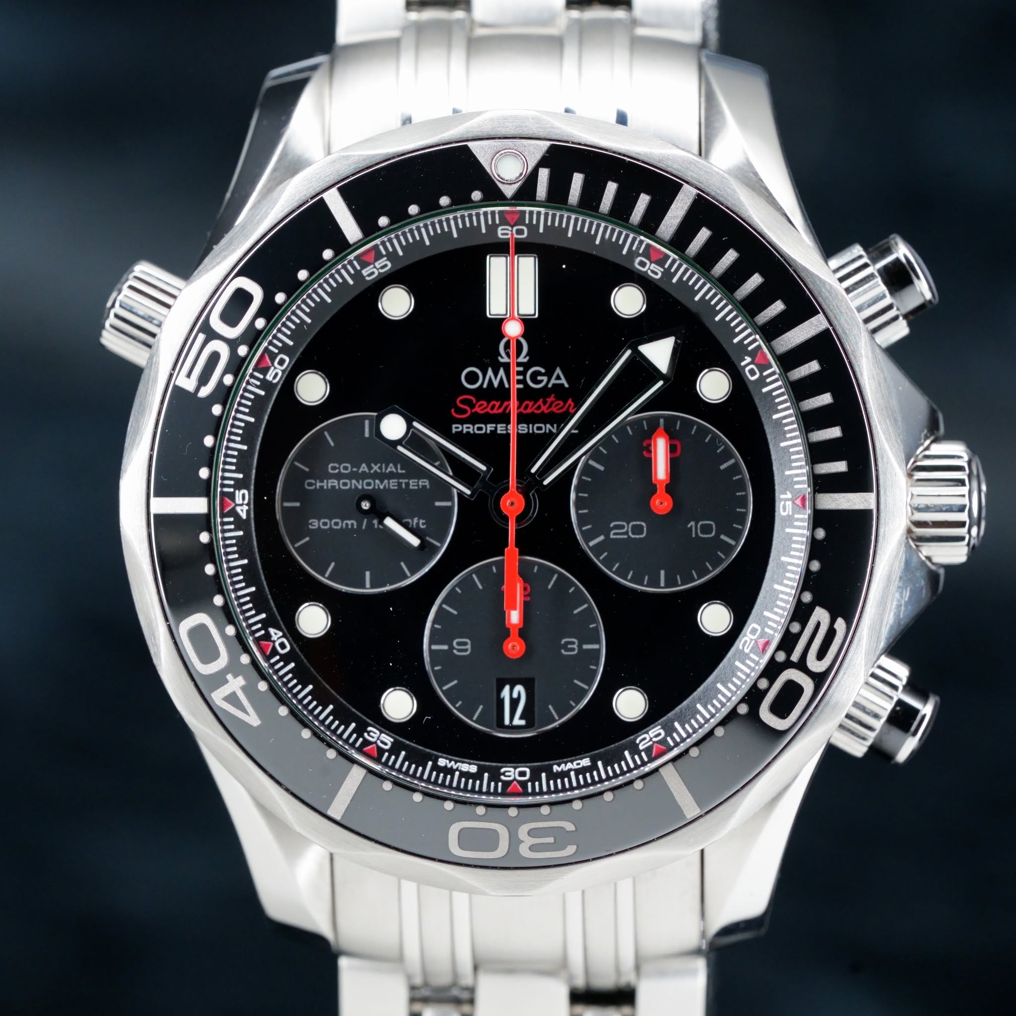 May be an image of wrist watch and text that says '60 55 05 OMEGA OM GA Sean Seamaste aster PROFE SION 10 CO CO-AXIAL AXIAL HRON HRONOME ب ባማ 50 45 ulmhılu 40 300m Ot বਂ ! GO…