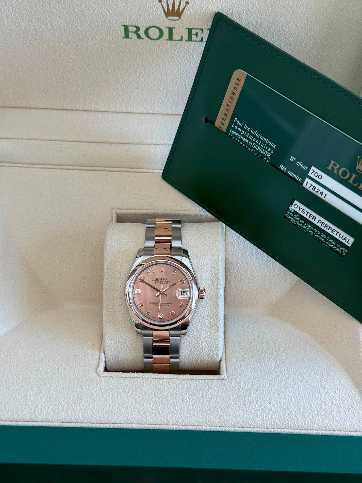 May be an image of wrist watch and text that says 'ROLE com comp Pourle Pour concermanta concerna enanta saires les informations aires emantlaGARANTIS CADALSS GARANTIE ntairons N…