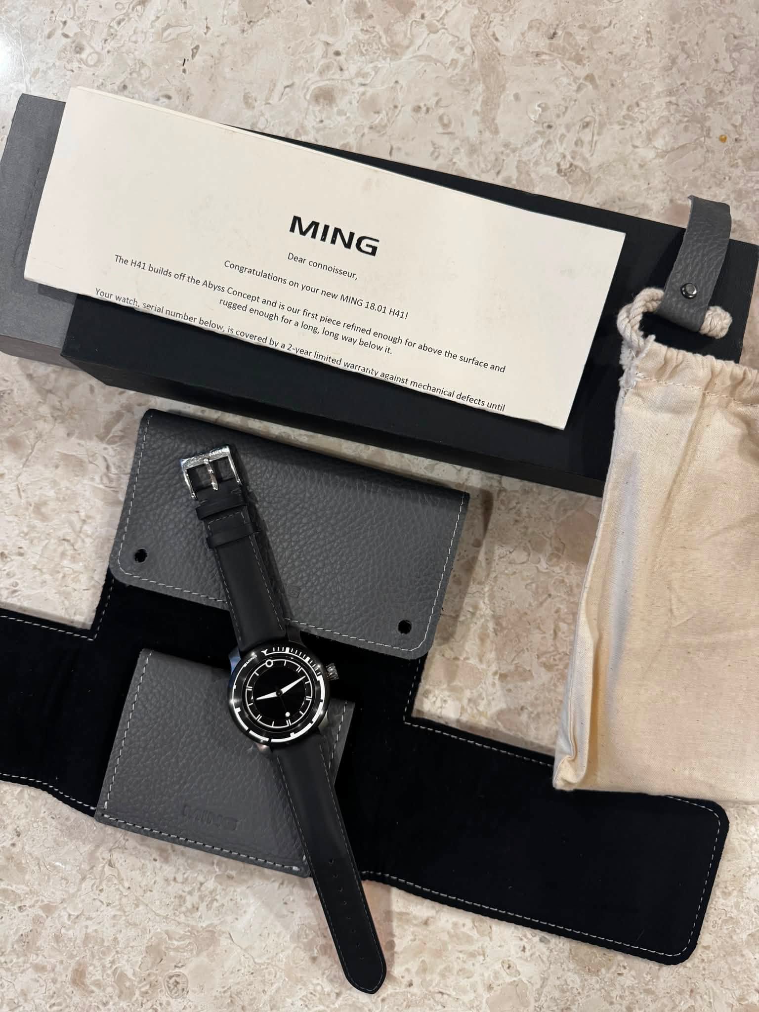 May be an image of wrist watch and text that says 'MING The 441 builds the Abysa byss uegede Concept Congratulationson Dear connoisseur, Your watsh, serial umber…