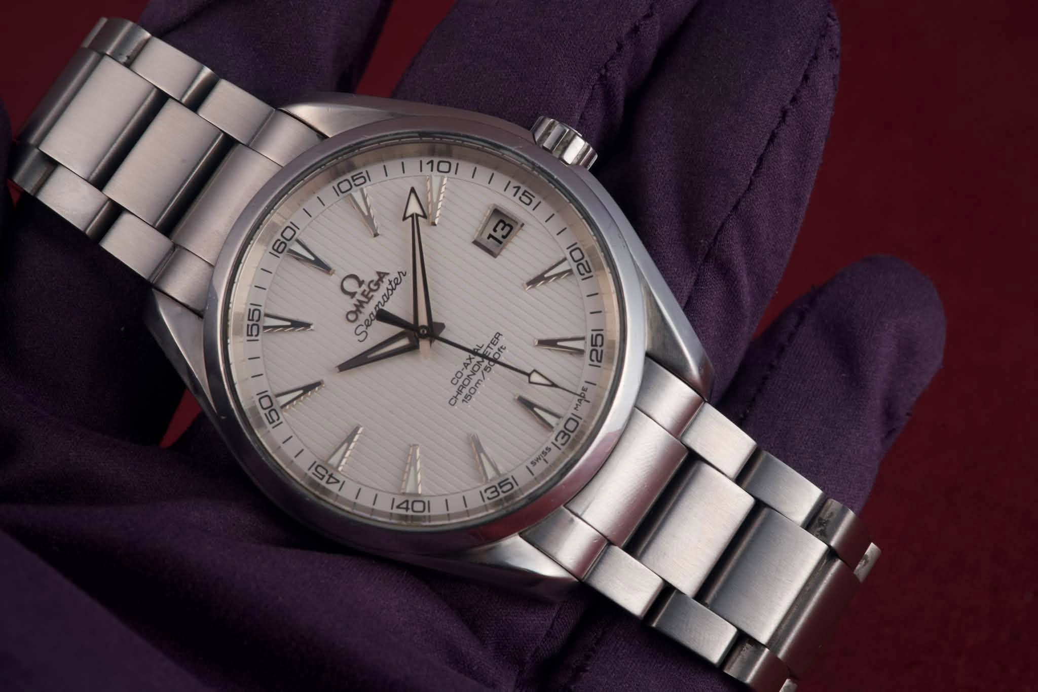 May be an image of wrist watch and text that says '105 ١١ 13B V 55 .. Seamaster naster И 200 ETER CO-AX 0 Oft CHF HRONOM RONOM 150m/ /mbe syss M SEI 194I ١١ 40I 140'