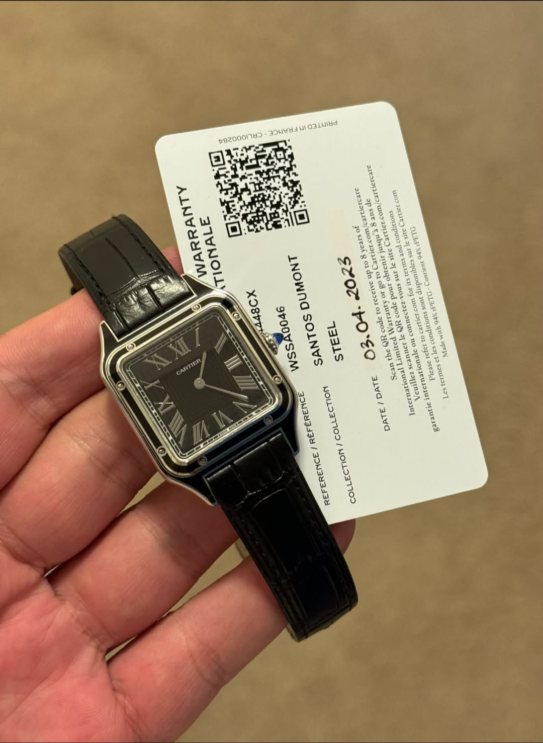 May be an image of wrist watch and text