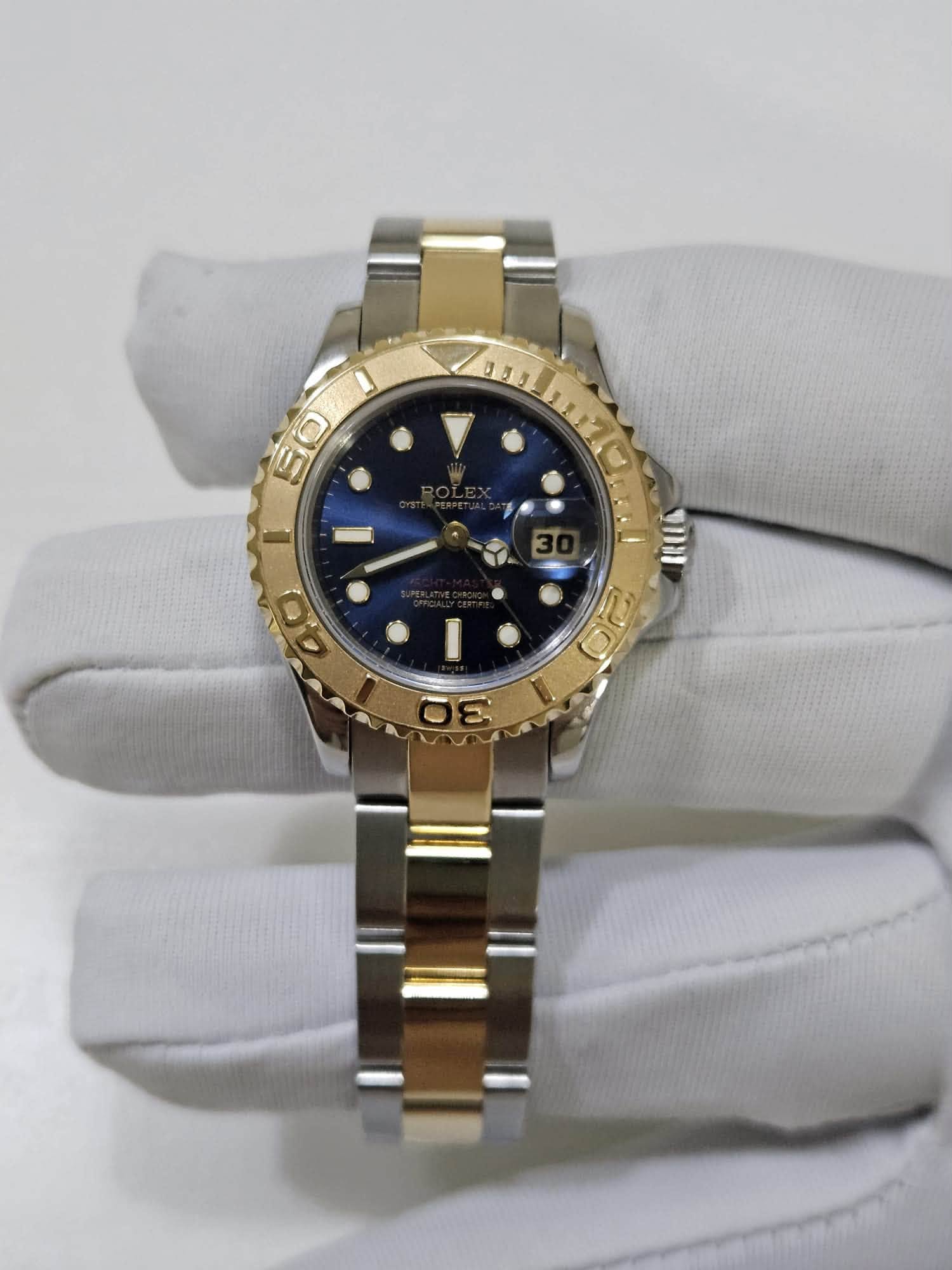May be an image of wrist watch and text