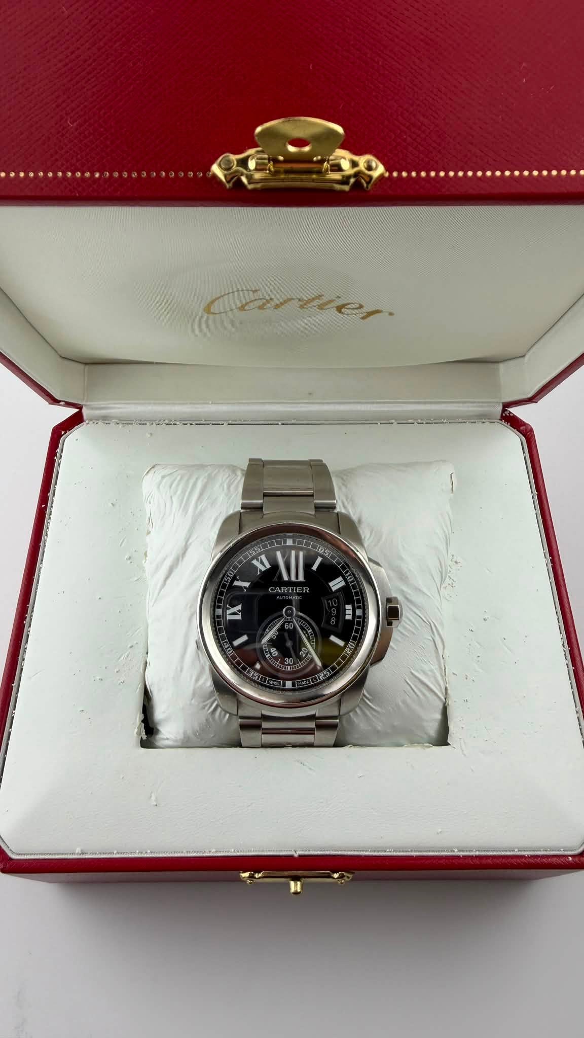 May be an image of wrist watch and text that says '.............. Cartie, XI II 2R5 I m'